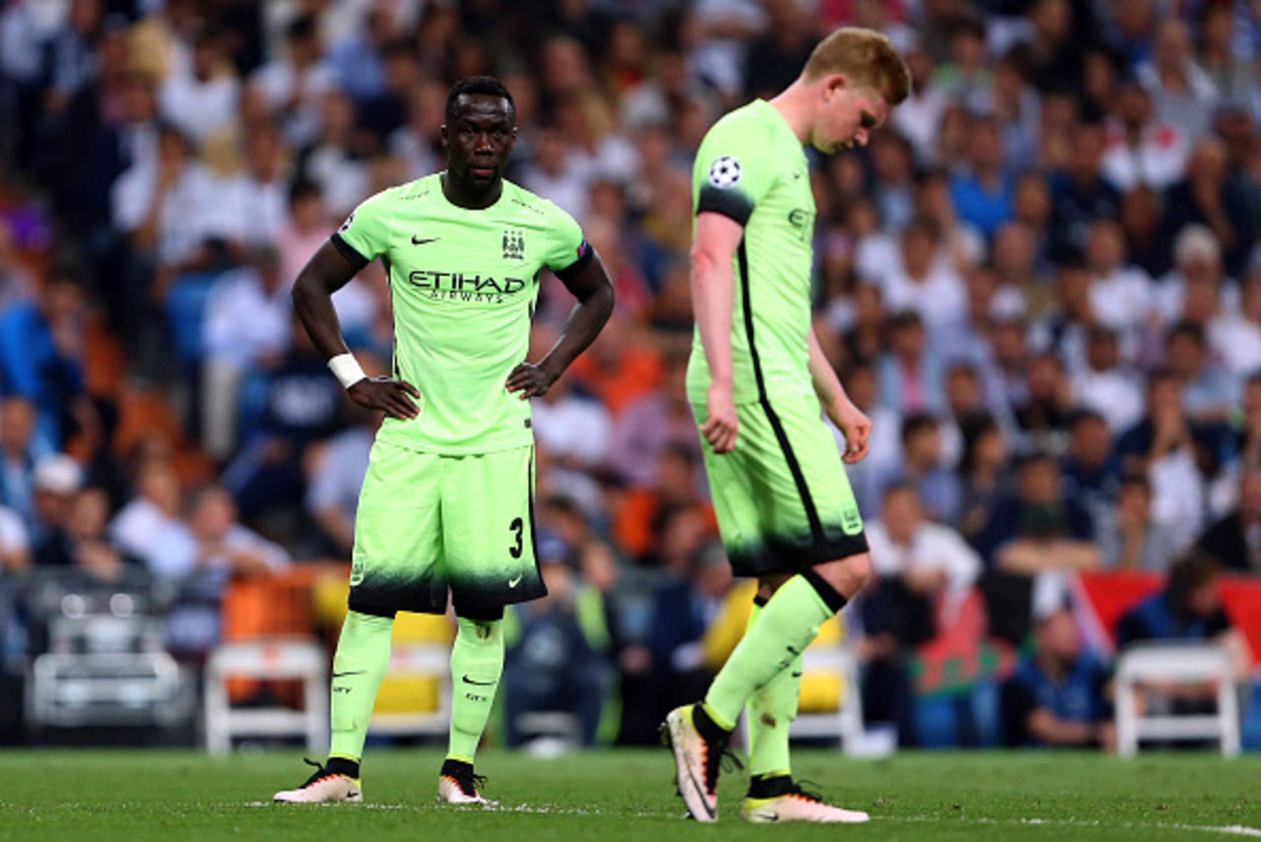 MADRID, SPAIN - MAY 04:  A dejected looking Bacary Sagna  and Kevin De Bruyne of Manchester City during the UEFA Champions League Semi Final second leg match between Real Madrid and Manchester City FC at Estadio Santiago Bernabeu on May 4, 2016 in Madrid,