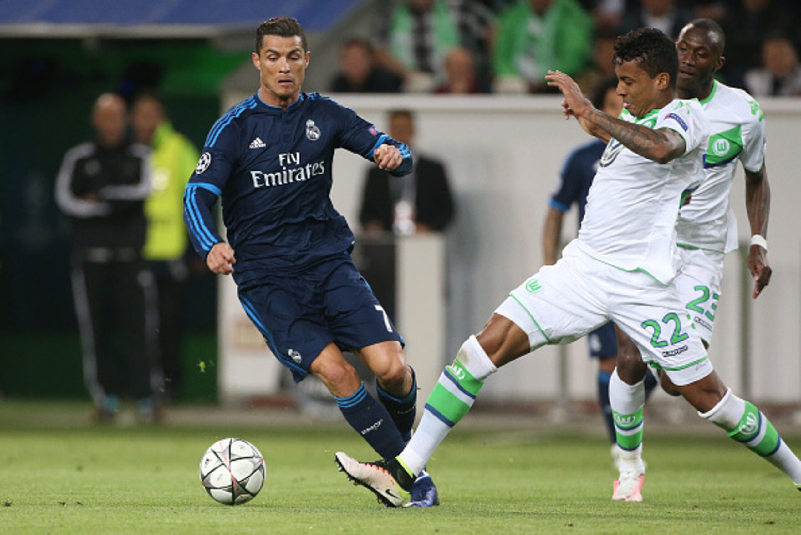WOLFSBURG, GERMANY - APRIL 6: Cristiano Ronaldo of Real Madrid and Luiz Gustavo of Wolfsburg in action during the UEFA Champions League quarter final first leg match between VfL Wolfsburg and Real Madrid at Volkswagen Arena on April 6, 2016 in Wolfsburg, 