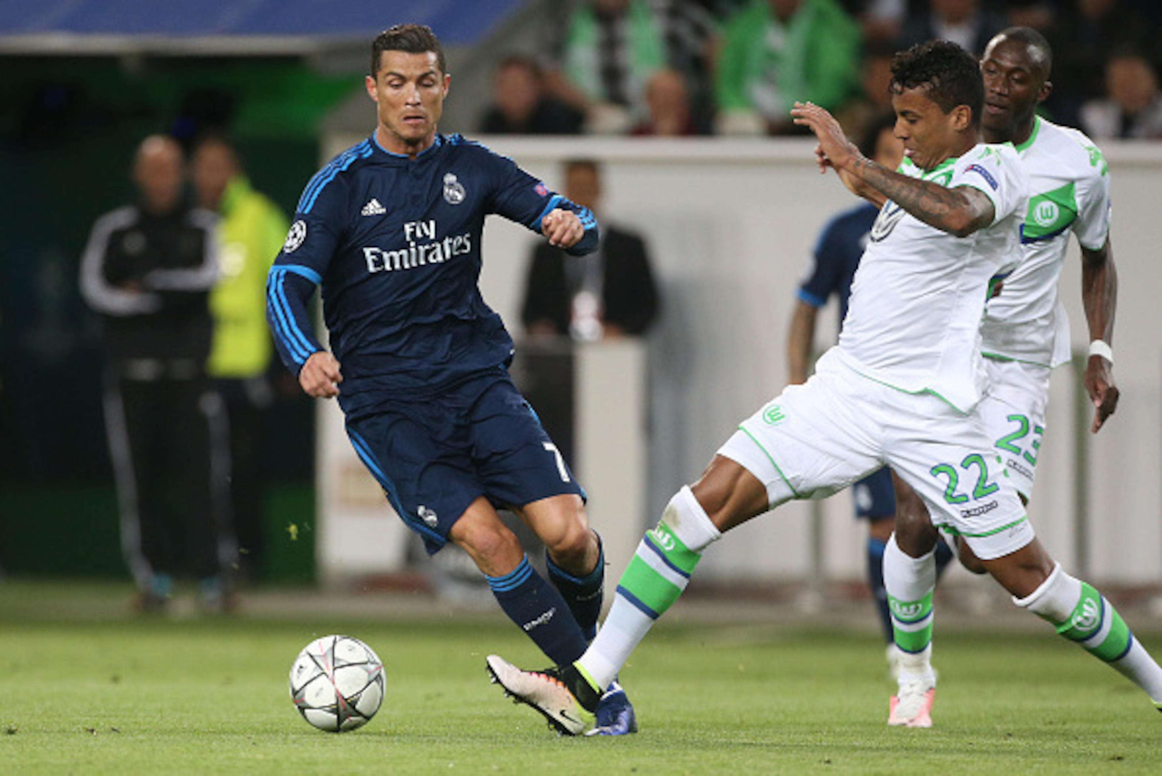 WOLFSBURG, GERMANY - APRIL 6: Cristiano Ronaldo of Real Madrid and Luiz Gustavo of Wolfsburg in action during the UEFA Champions League quarter final first leg match between VfL Wolfsburg and Real Madrid at Volkswagen Arena on April 6, 2016 in Wolfsburg, 