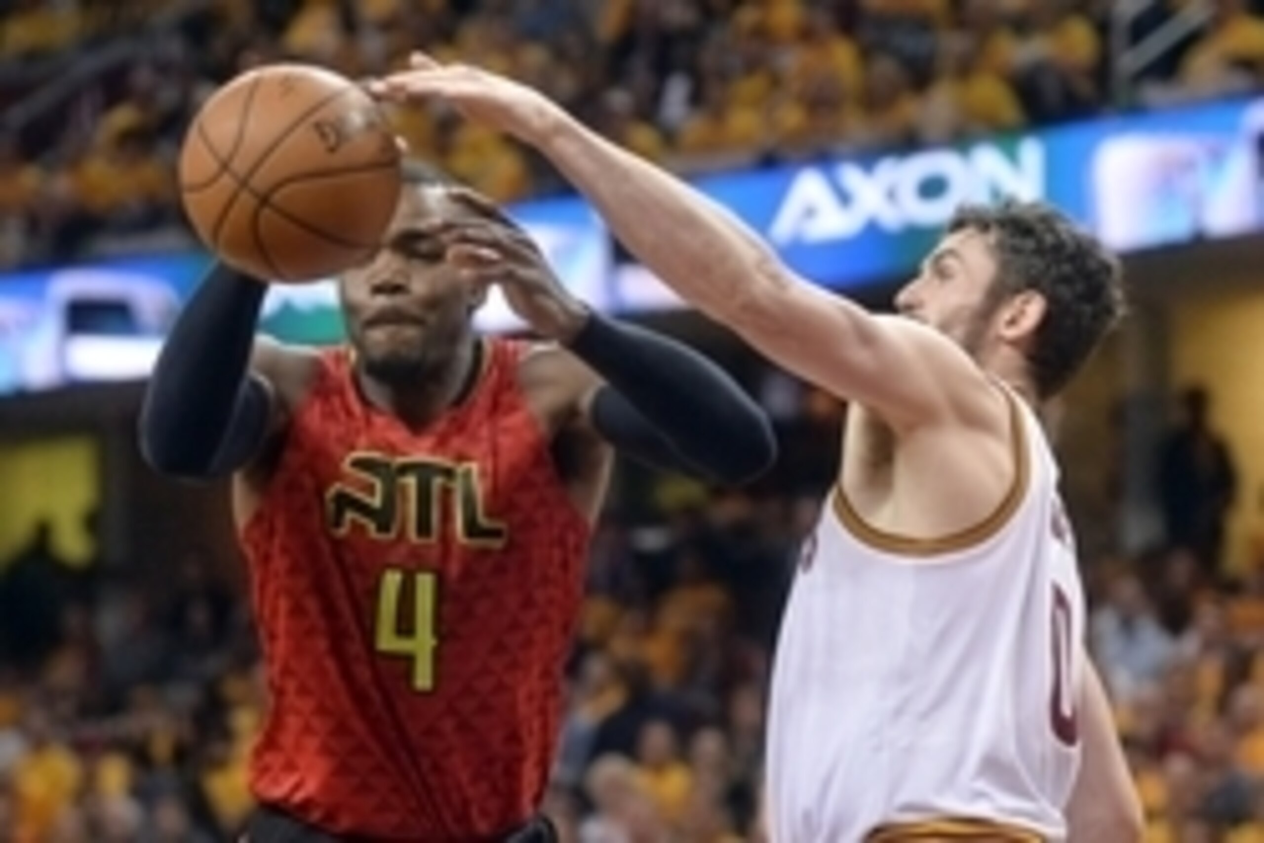 May 2, 2016; Cleveland, OH, USA; Cleveland Cavaliers forward Kevin Love (0) defends Atlanta Hawks forward Paul Millsap (4) during the second half in game one of the second round of the NBA Playoffs at Quicken Loans Arena. The Cavs won 104-93. Mandatory Cr
