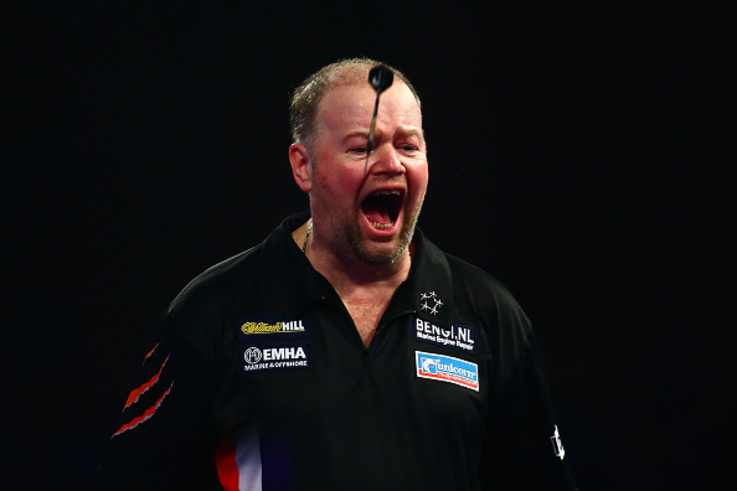 LONDON, ENGLAND - DECEMBER 29:  Raymond van Barneveld of Holland celebrates a set point in his third round match against Michael van Gerwen of Holland on Day Eleven of the 2016 William Hill PDC World Darts Championships at Alexandra Palace on December 29,