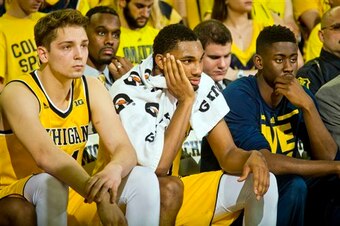 Caris LeVert, far right, spent most of his senior season in street clothes.