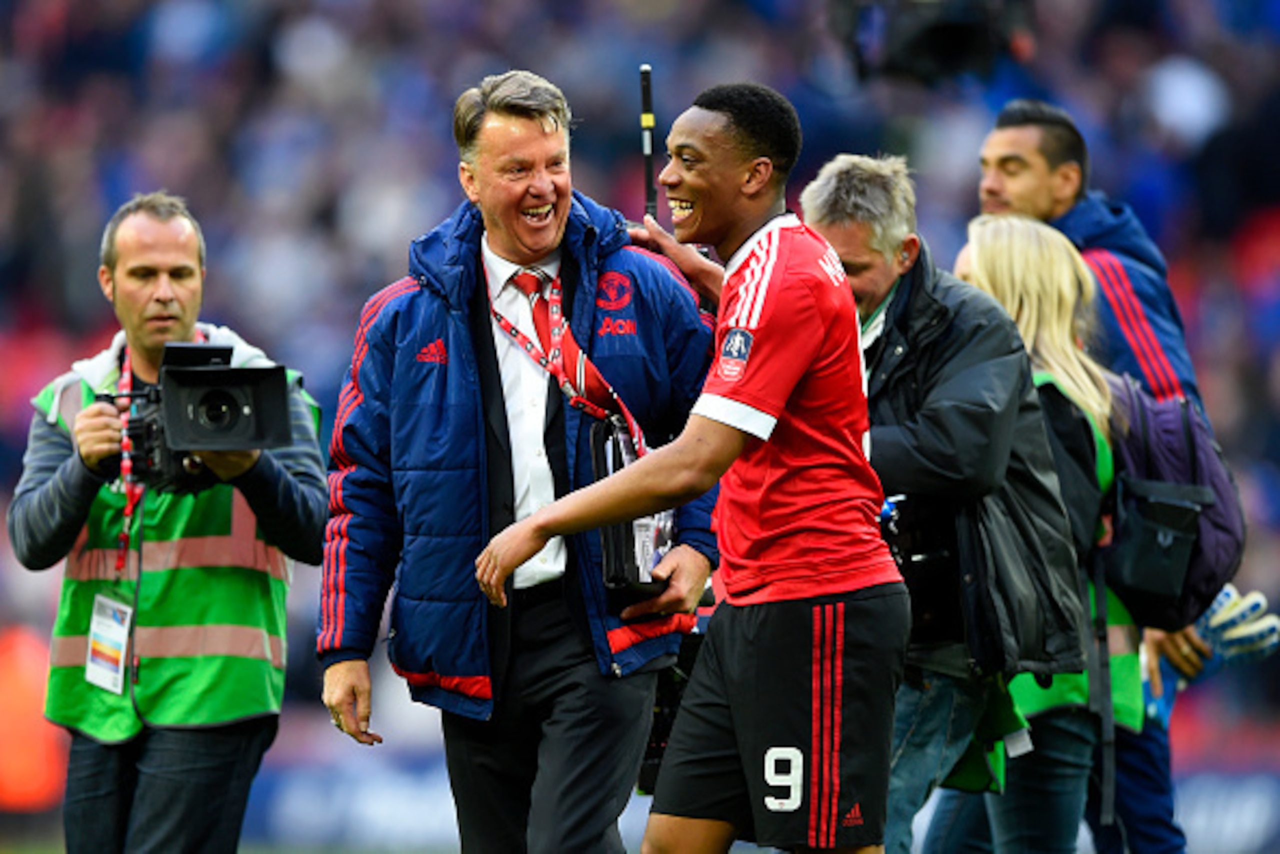 LONDON, ENGLAND - APRIL 23:  Louis van Gaal manager of Manchester United celebrates with winning goalscorer Anthony Martial of Manchester United after victory in The Emirates FA Cup semi final match between Everton and Manchester United at Wembley Stadium
