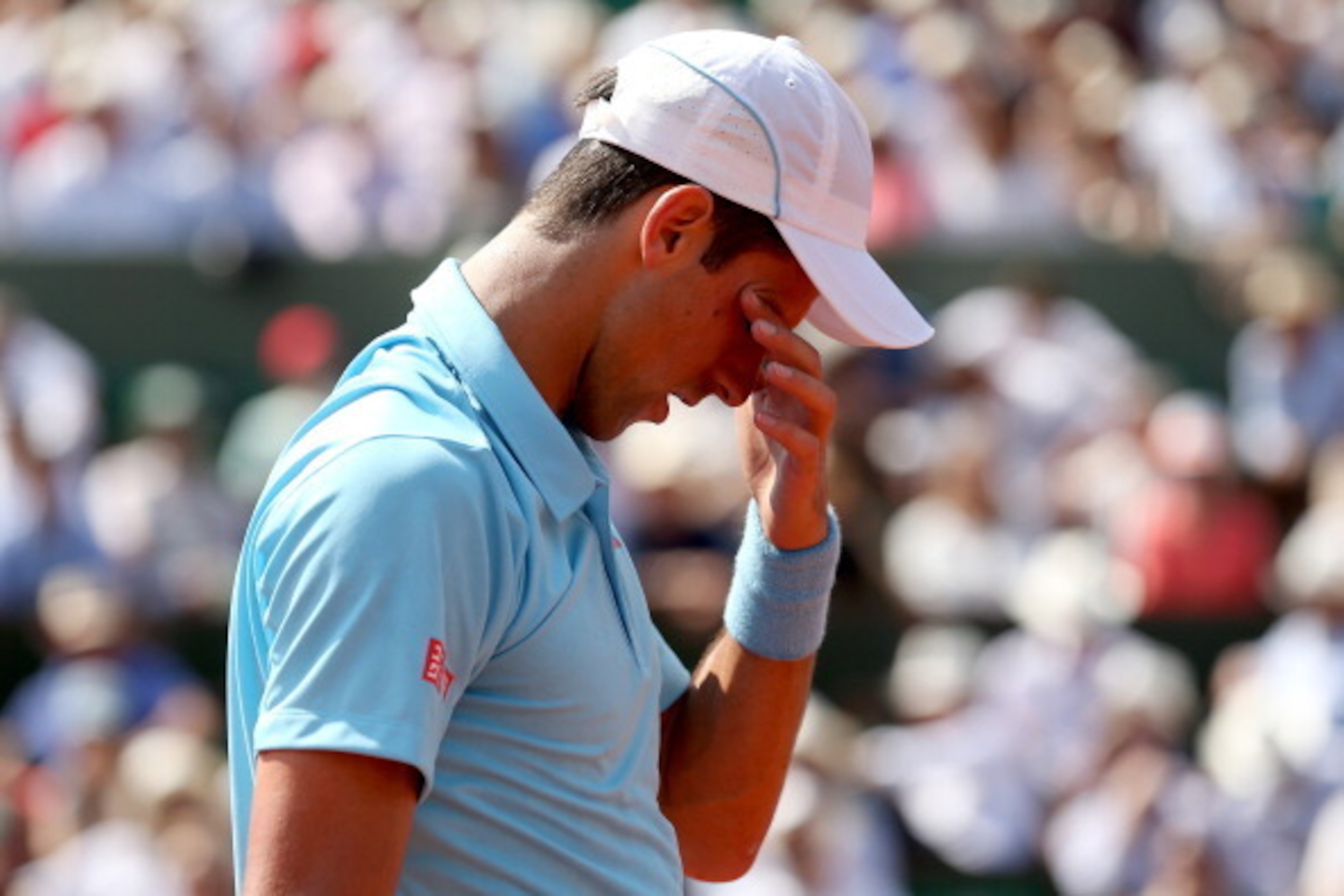 PARIS, FRANCE - JUNE 08:  Novak Djokovic of Serbia reacts during his men's singles final match against Rafael Nadal of Spain on day fifteen of the French Open at Roland Garros on June 8, 2014 in Paris, France.  (Photo by Matthew Stockman/Getty Images)