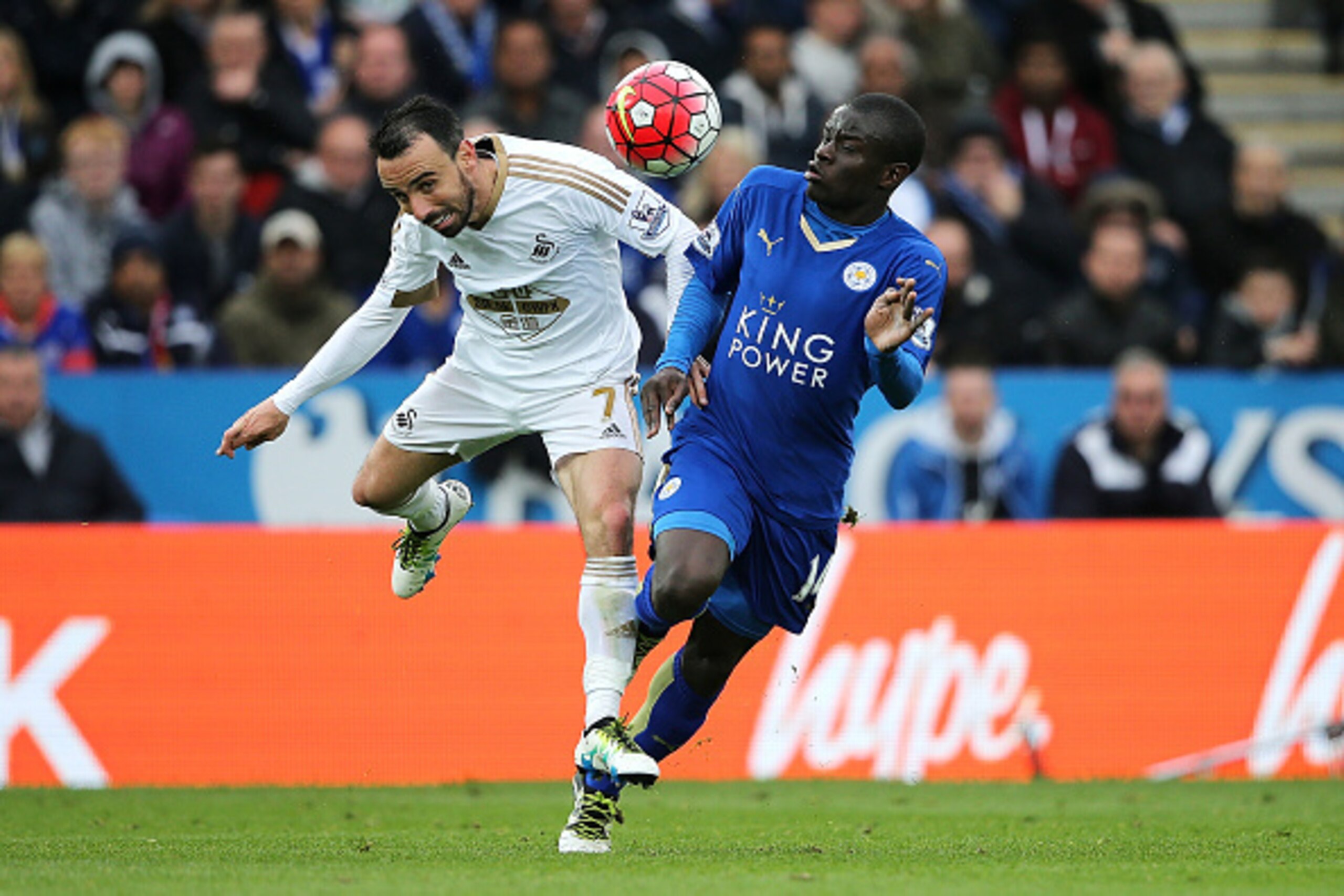 LEICESTER, ENGLAND - APRIL 24:  N'Golo Kante of Leicester City competes with Leon Britton of Swansea City during the Barclays Premier League match between Leicester City and Swansea City at The King Power Stadium on April 24, 2016 in Leicester, United Kin