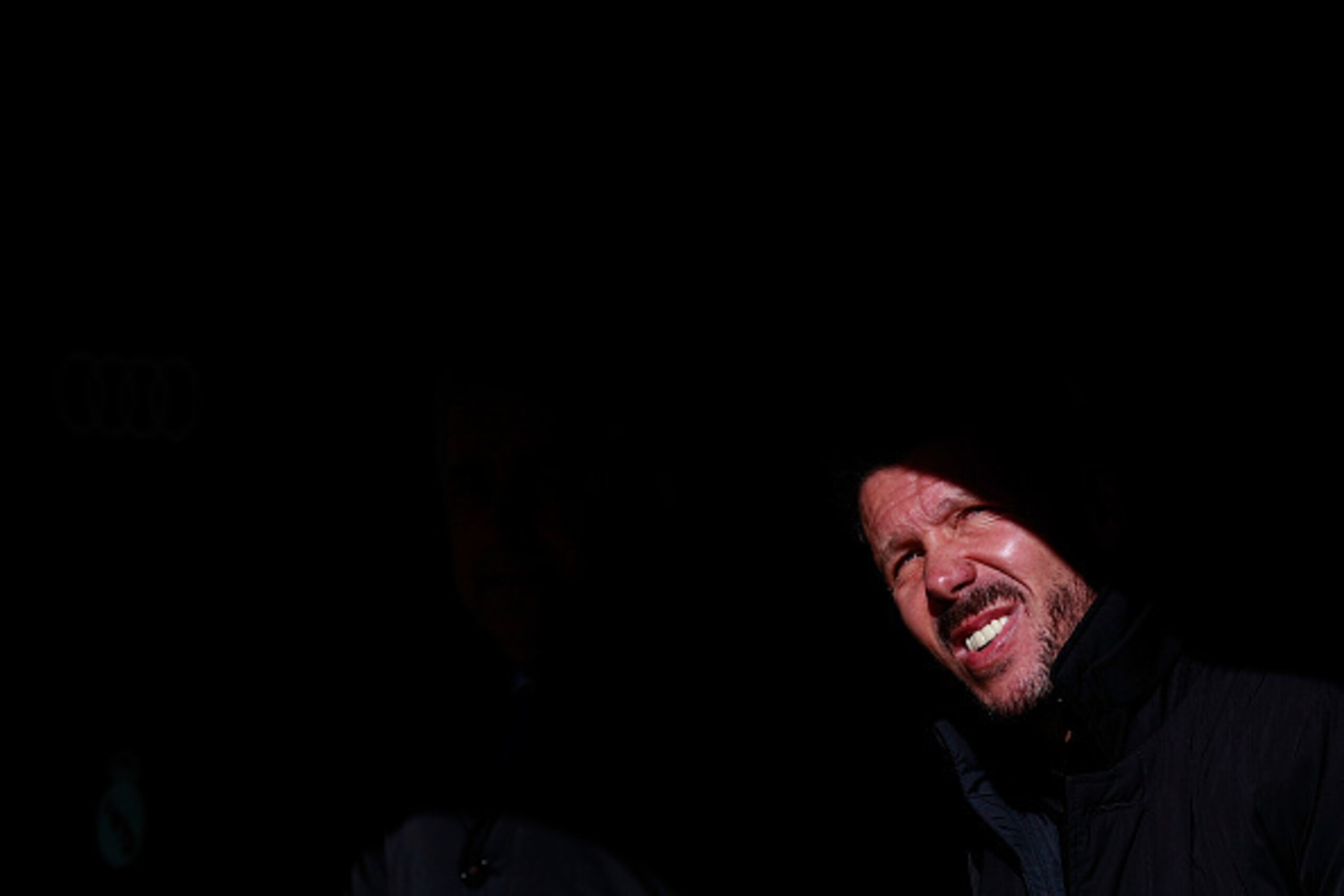 MADRID, SPAIN - FEBRUARY 27: Head coach Diego Pablo Simeone of Atletico de Madrid looks up sitted on the bench prior to start the La Liga match between Real Madrid CF and Club Atletico de Madrid at Estadio Santiago Bernabeu on February 27, 2016 in Madrid,