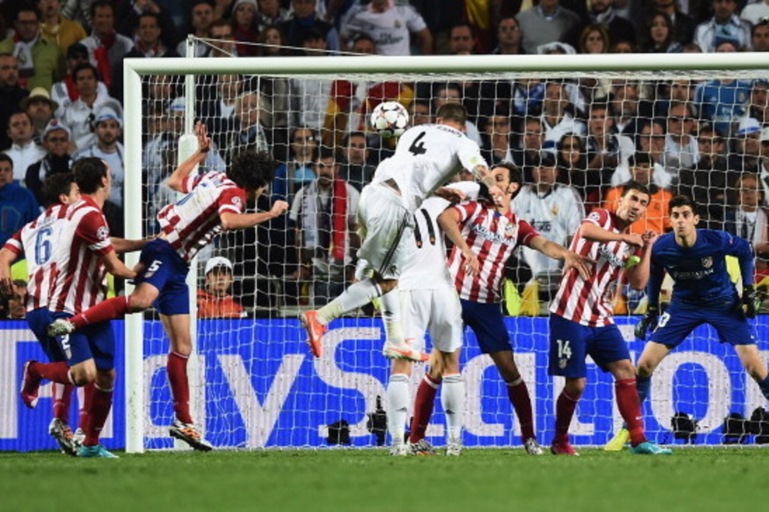 LISBON, PORTUGAL - MAY 24:  Sergio Ramos of Real Madrid (4) scores their first goal with a header during the UEFA Champions League Final between Real Madrid and Atletico de Madrid at Estadio da Luz on May 24, 2014 in Lisbon, Portugal.  (Photo by Laurence 