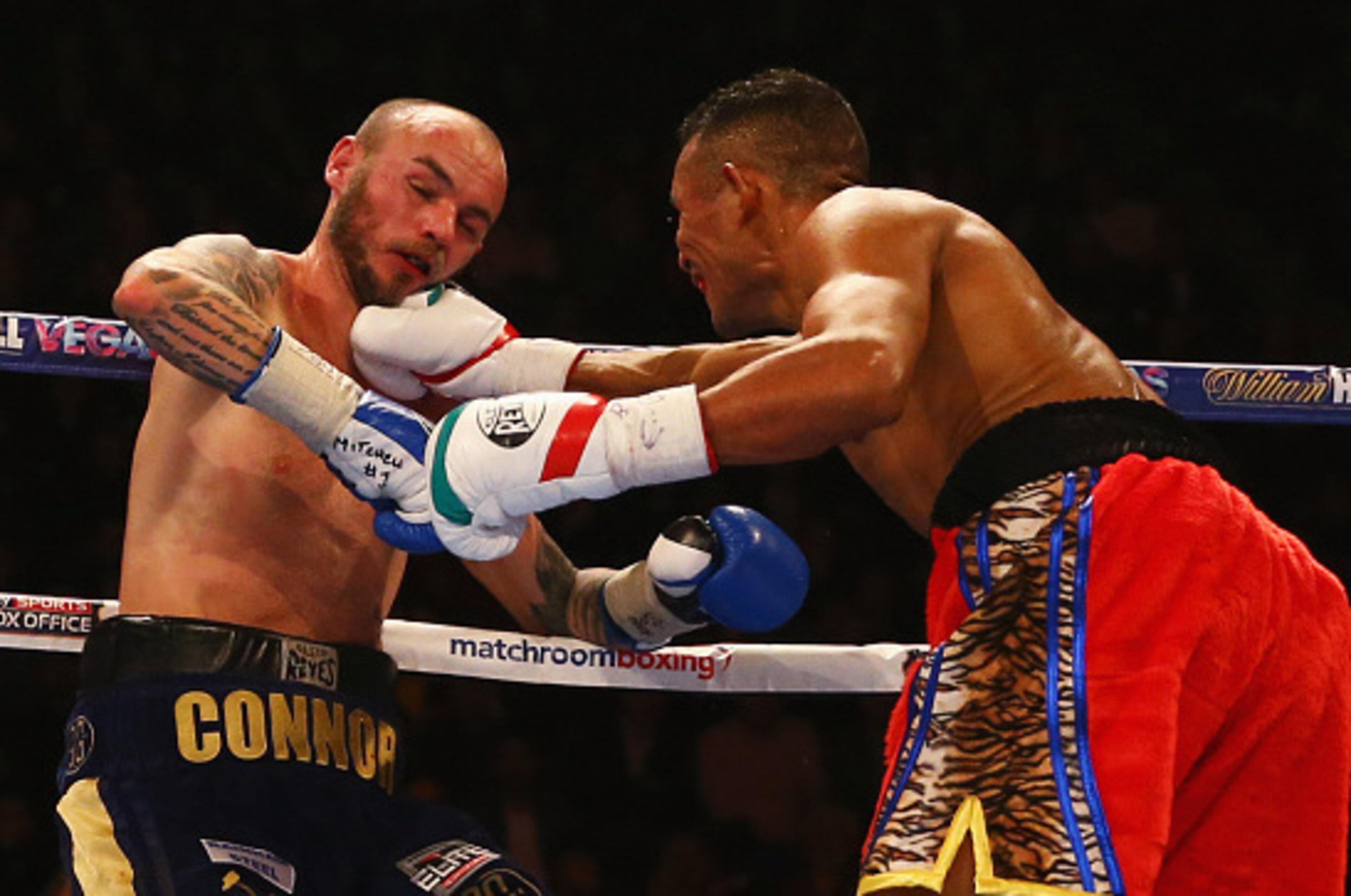 LONDON, ENGLAND - DECEMBER 12:  Kevin Mitchell (L) is knocked down by Ismael Barroso during the WBA Interim Lightweight title contest at The O2 Arena on December 12, 2015 in London, England. Barroso stopped Mitchell in the fifth round. (Photo by Richard H