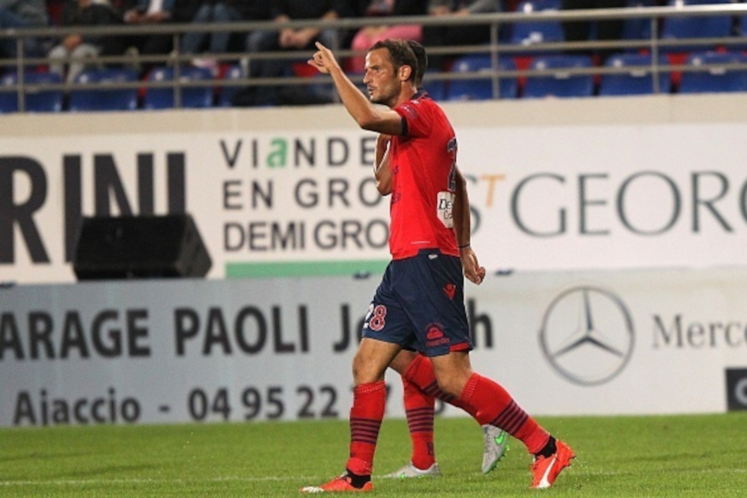 Ajaccio's French forward Gregory Pujol celebrates after scoring a goal during the French L1 football match GFC Ajaccio (GFCA) against Toulouse (TFC) on October 3,  2015 at the Ange Casanova stadium in Ajaccio, French Mediterranean island of Corsica. AFP P