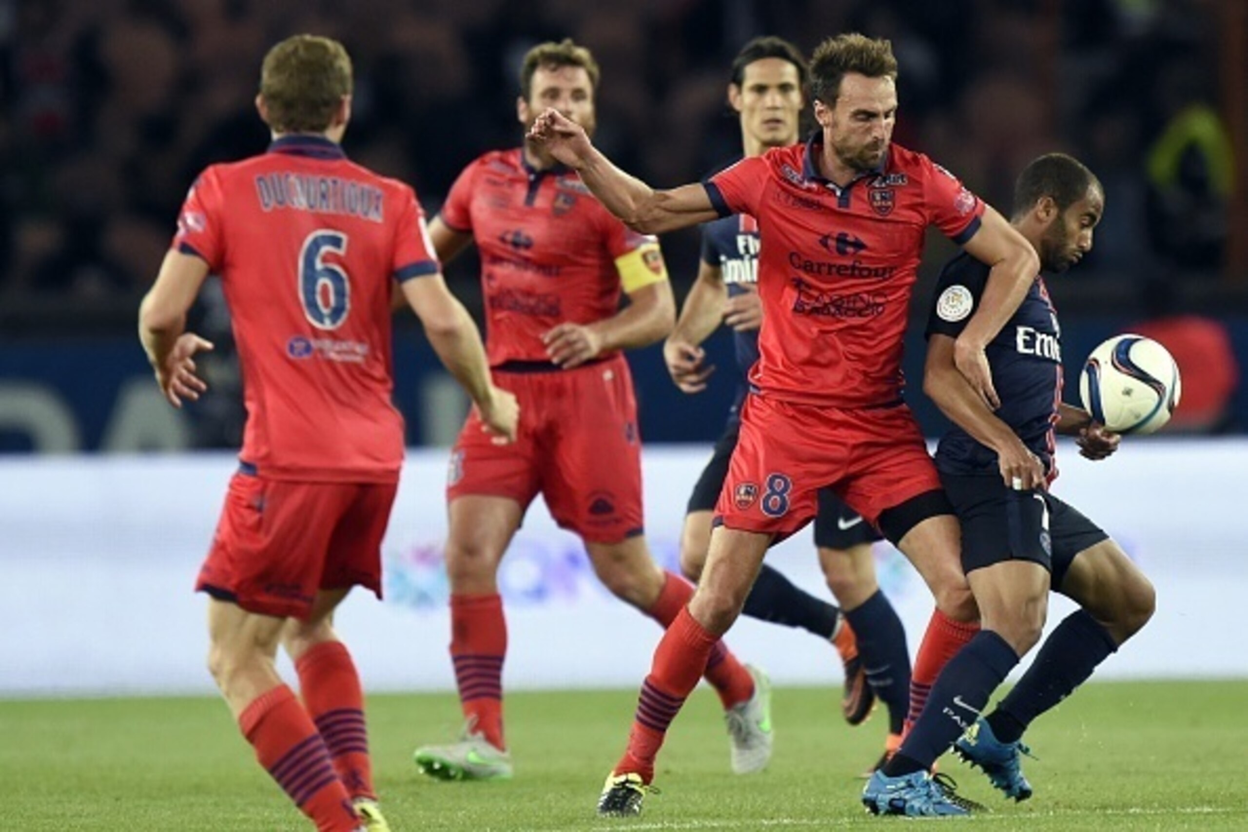 GFC Ajaccio's French midfielder Jerome Le Moigne (2nd L) vies with Paris Saint-Germain Brazilian forward Lucas Moura (L) during the French L1 football match between Paris Saint-Germain and GFC Ajaccio on August 16, 2015 at the Parc des Princes stadium in 
