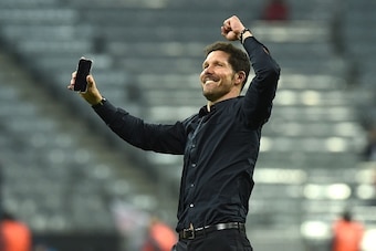 TOPSHOT - Atletico Madrid's Argentinian coach Diego Simeone celebrates qualifying for the final after the UEFA Champions League semi-final, second-leg football match between FC Bayern Munich and Atletico Madrid in Munich, southern Germany, on May 3, 2016.