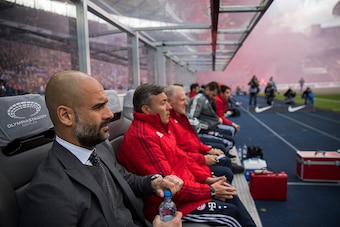 Bayern Munich's Spanish head coach Pep Guardiola sits on the bench during the German first division Bundesliga football match between Hertha BSC and FC Bayern Munich in Berlin, on April 23, 2016.   / AFP / ODD ANDERSEN / RESTRICTIONS: DURING MATCH TIME: D