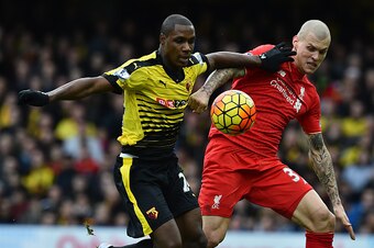 Watford's Nigerian striker Odion Ighalo (L) vies with Liverpool's Slovakian defender Martin Skrtel before scoring their second goal during the English Premier League football match between Watford and Liverpool at Vicarage Road Stadium in Watford, north o
