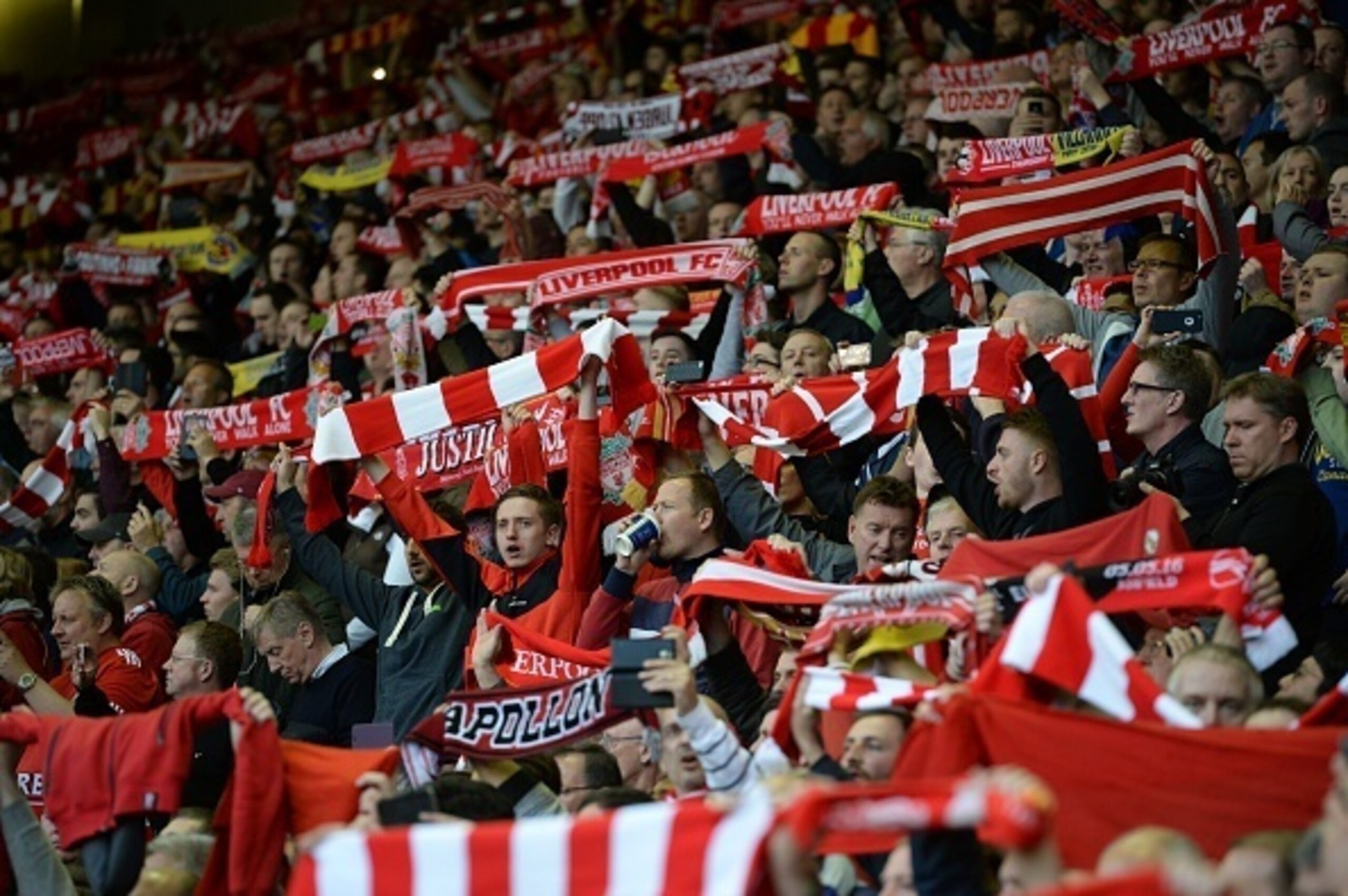 Liverpool fans cheer their team during the UEFA Europa League semi-final second leg football match between Liverpool and Villarreal CF at Anfield in Liverpool, northwest England on May 5, 2016. / AFP / OLI SCARFF        (Photo credit should read OLI SCARF