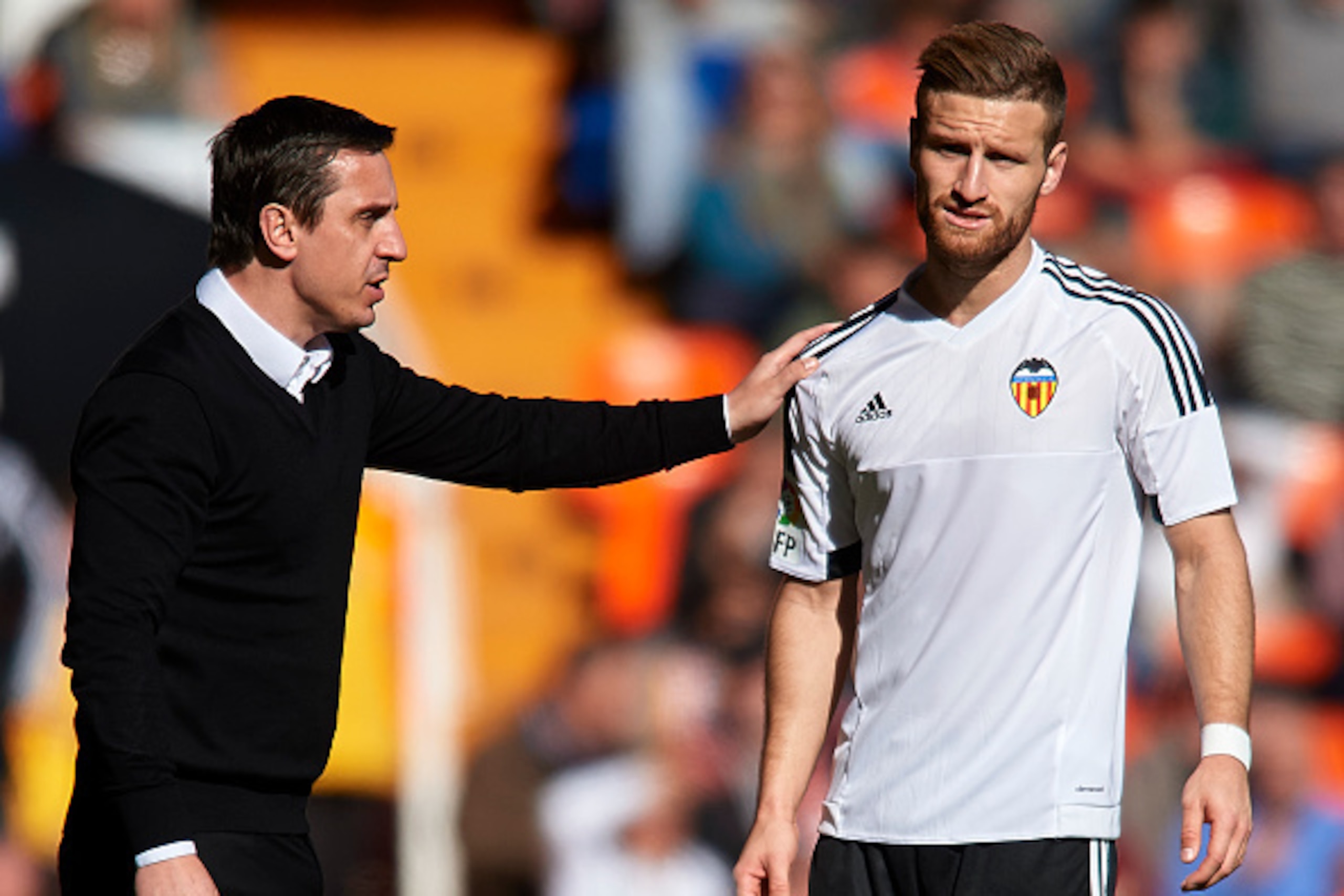 VALENCIA, SPAIN - JANUARY 17:  Gary Neville manager of Valencia CF gives instructions to his player Shkodran Mustafi during the La Liga match between Valencia CF and Rayo Vallecano at Estadi de Mestalla on January 17, 2016 in Valencia, Spain.  (Photo by M