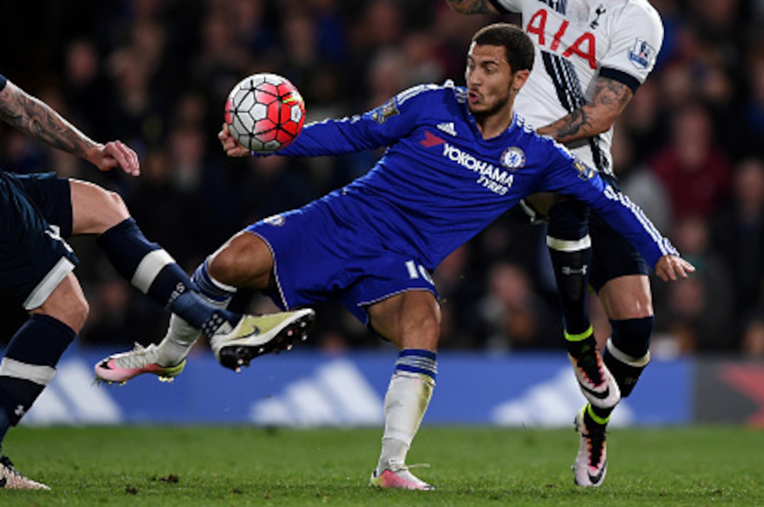 LONDON, ENGLAND - MAY 02:  Eden Hazard of Chelsea battles for the ball with Toby Alderweireld (L) and Kyle Walker (R) of Tottenham Hotspur during the Barclays Premier League match between Chelsea and Tottenham Hotspur at Stamford Bridge on May 02, 2016 in