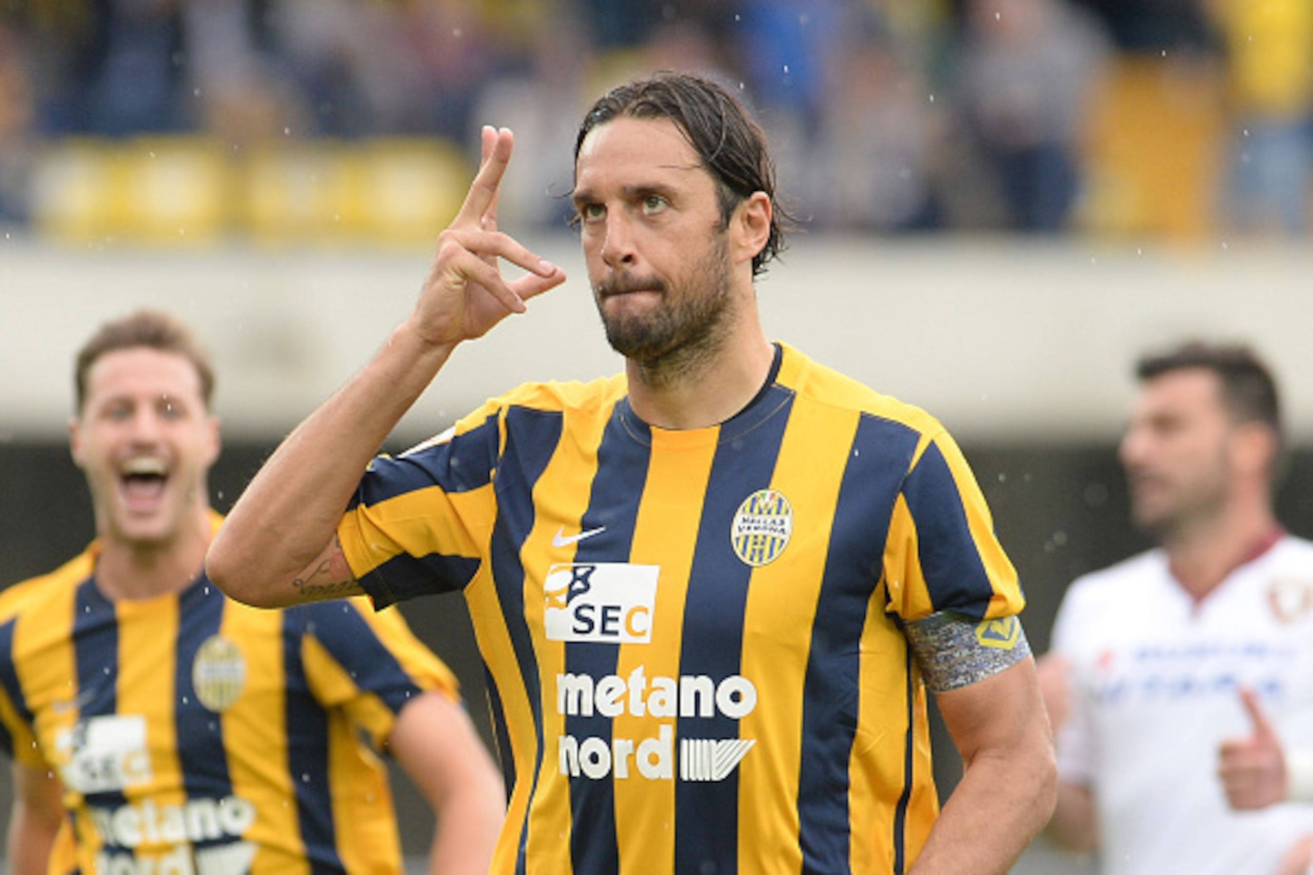 VERONA, ITALY - SEPTEMBER 13: Luca Toni of Helas Verona celebrates after scoring his opening goal from the penalthy spot during the Serie A match between Hellas Verona FC and Torino FC at Stadio Marc'Antonio Bentegodi on September 13, 2015 in Verona, It VERONA, ITALY - SEPTEMBER 13: Luca Toni of Helas Verona celebrates after scoring his opening goal from the penalthy spot during the Serie A match between Hellas Verona FC and Torino FC at Stadio Marc'Antonio Bentegodi on September 13, 2015 in Verona, It