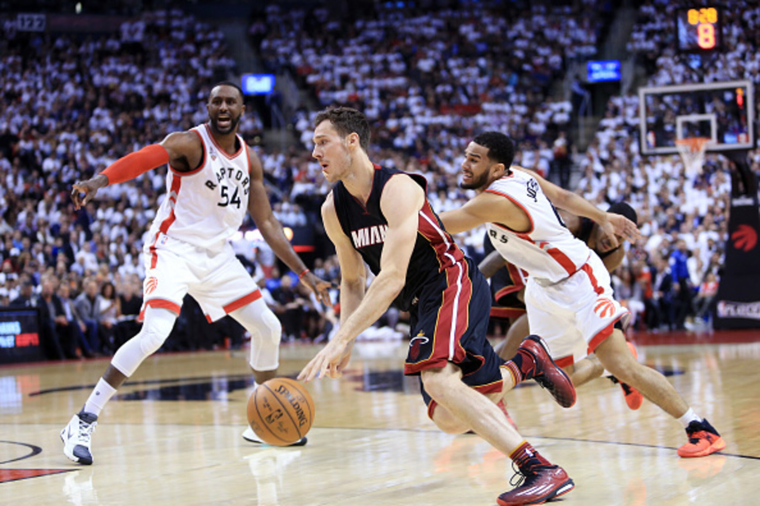TORONTO, ON - MAY 05:  Goran Dragic #7 of the Miami Heat dribbles the ball as Patrick Patterson #54 and Cory Joseph #6 of the Toronto Raptors defend in the second half of Game Two of the Eastern Conference Semifinals during the 2016 NBA Playoffs at the Ai