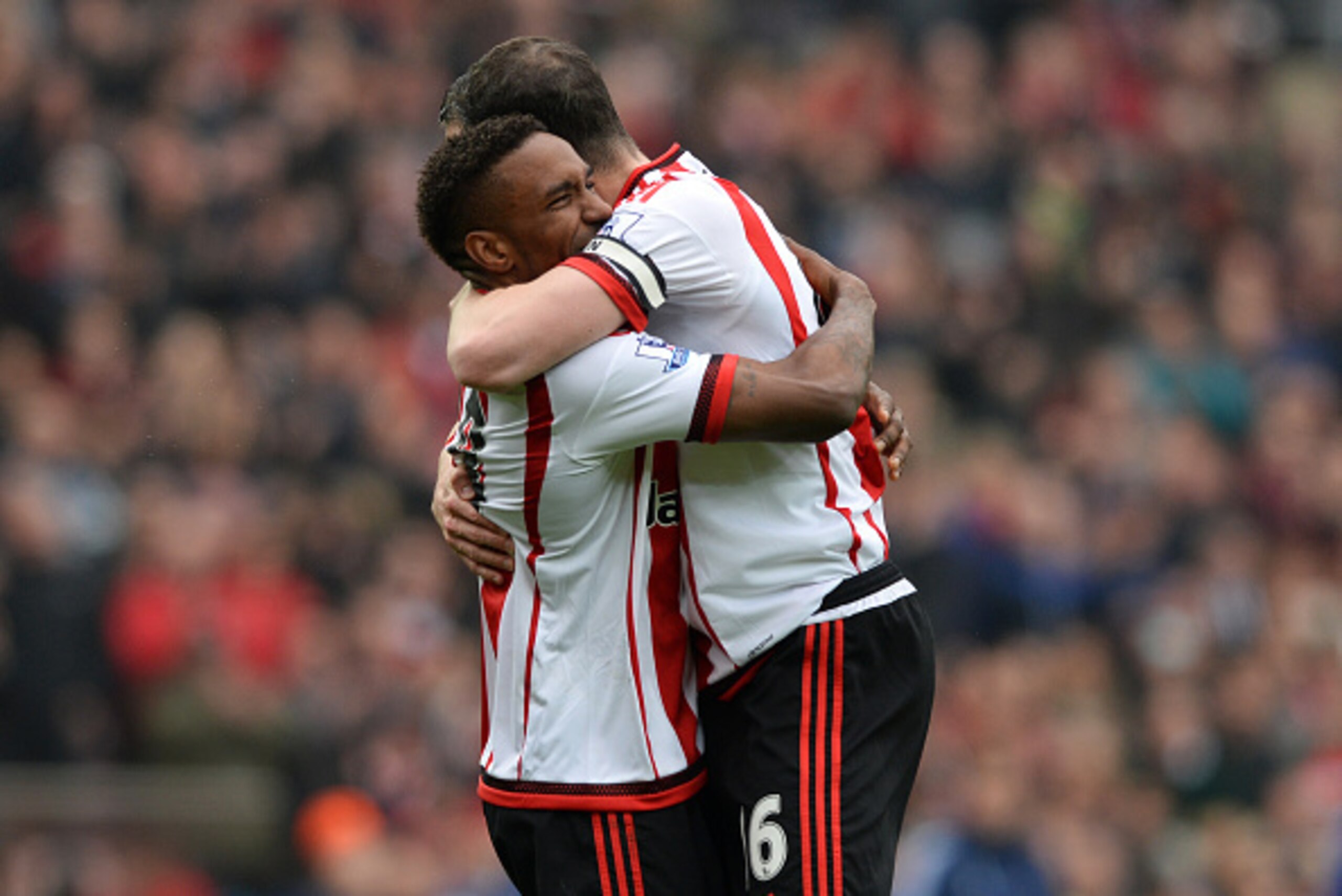 SUNDERLAND, ENGLAND - MAY 07:  Jermain Defoe (L) and John O'Shea (R) of Sunderland celebrate their team's 3-2 win in the Barclays Premier League match between Sunderland and Chelsea at the Stadium of Light on May 7, 2016 in Sunderland, United Kingdom.  (P