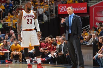 CLEVELAND,OH - MAY 4 :  Head Coach Tyronn Lue of the Cleveland Cavaliers talks things over with LeBron James #23 against the Atlanta Hawks during the Eastern Conference Semifinals Game One on May 4, 2016 at The Quicken Loans Arena in Cleveland, Ohio. NOTE