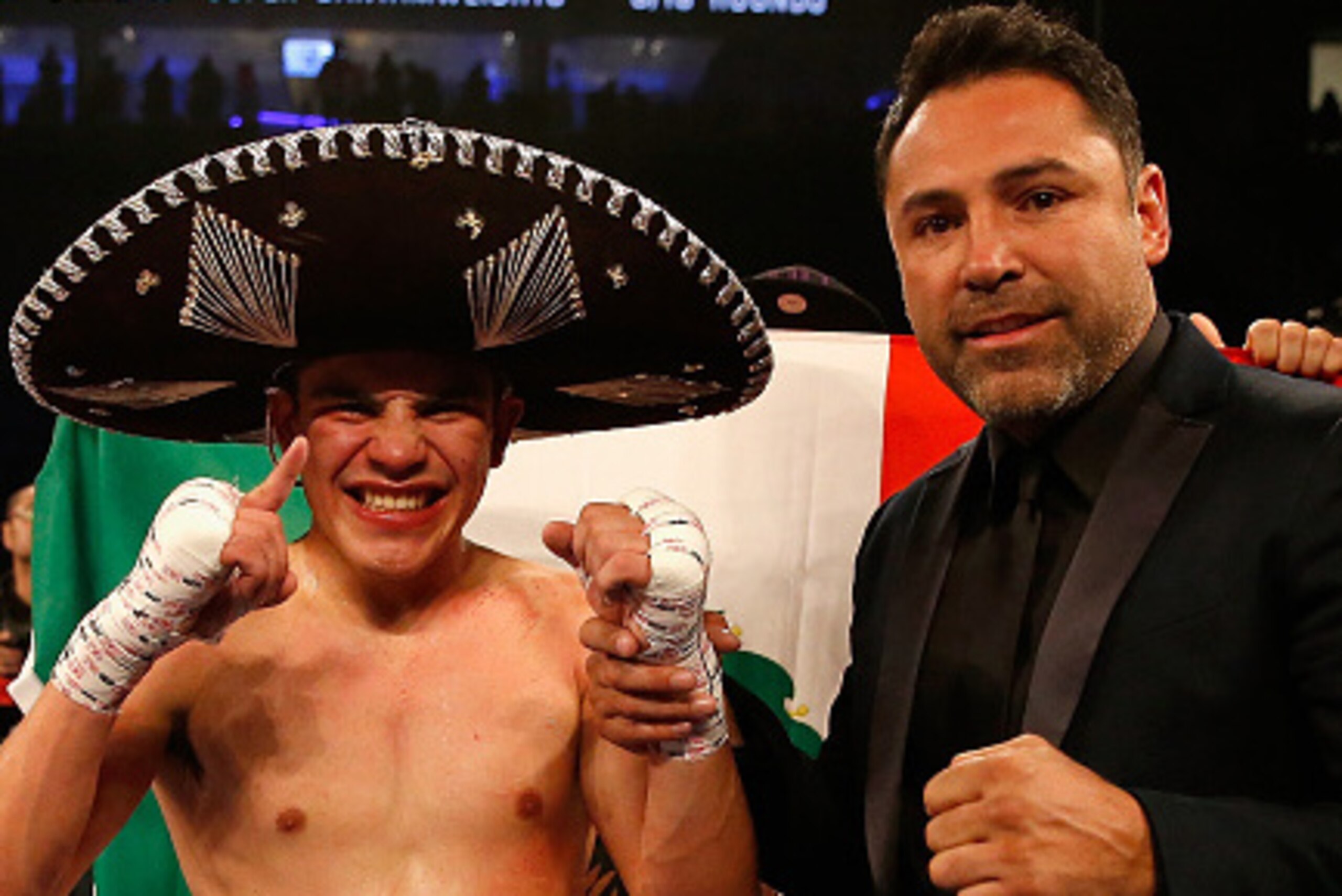 LAS VEGAS, NEVADA - MAY 07:  Diego De La Hoya (L) celebrates his TKO win with former professional boxer and founder of Golden Boy Promotions, Oscar De La Hoya during the super bantamweight fight at T-Mobile Arena on May 7, 2016 in Las Vegas, Nevada.  (Pho