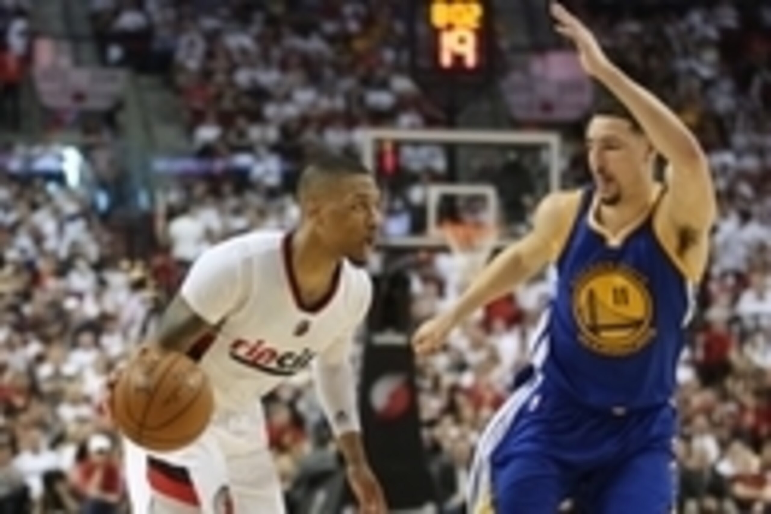 May 7, 2016; Portland, OR, USA; Portland Trail Blazers guard Damian Lillard (0) dribbles past Golden State Warriors guard Klay Thompson (11) in game three of the second round of the NBA Playoffs at Moda Center at the Rose Quarter. Mandatory Credit: Jaime 