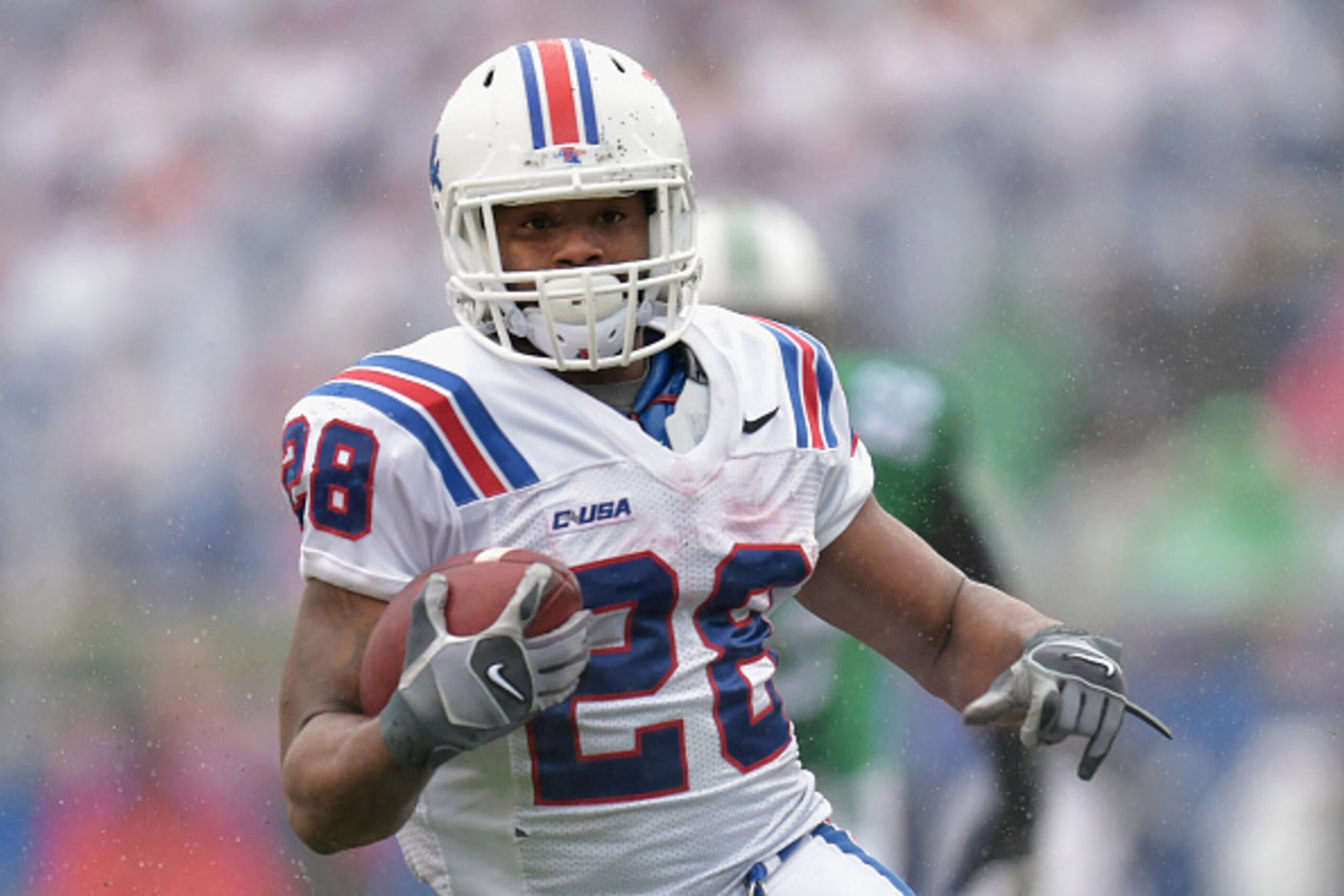 HUNTINGTON, WV - DECEMBER 06: Kenneth Dixon #28 of the Louisiana Tech Bulldogs carries the ball during the 2nd quarter against the Marshall Thundering Herd at Joan C. Edwards Stadium during the Conference USA championship game on December 6, 2014 in Hunti HUNTINGTON, WV - DECEMBER 06: Kenneth Dixon #28 of the Louisiana Tech Bulldogs carries the ball during the 2nd quarter against the Marshall Thundering Herd at Joan C. Edwards Stadium during the Conference USA championship game on December 6, 2014 in Hunti