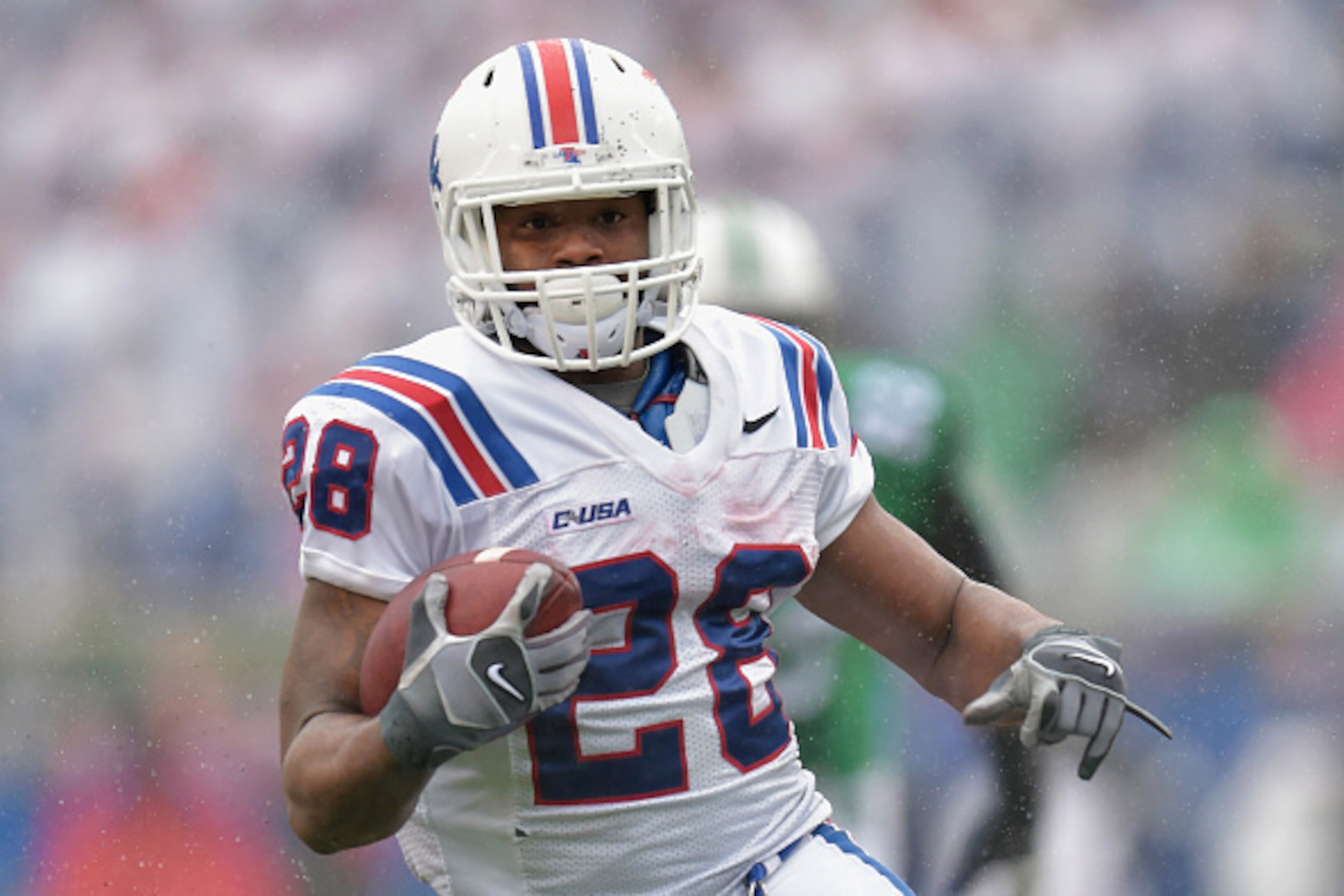 HUNTINGTON, WV - DECEMBER 06: Kenneth Dixon #28 of the Louisiana Tech Bulldogs carries the ball during the 2nd quarter against the Marshall Thundering Herd at Joan C. Edwards Stadium during the Conference USA championship game on December 6, 2014 in Hunti HUNTINGTON, WV - DECEMBER 06: Kenneth Dixon #28 of the Louisiana Tech Bulldogs carries the ball during the 2nd quarter against the Marshall Thundering Herd at Joan C. Edwards Stadium during the Conference USA championship game on December 6, 2014 in Hunti