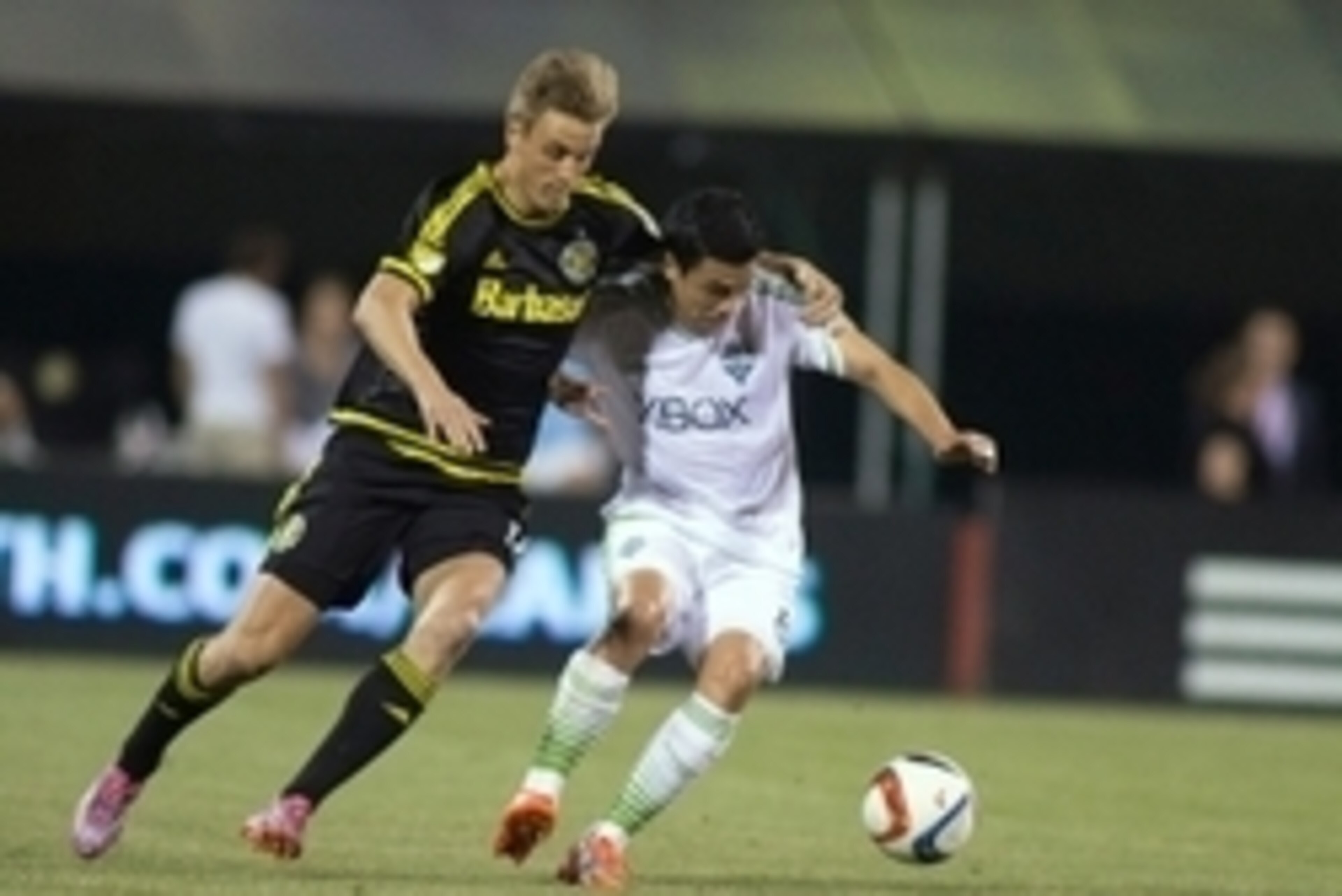 May 9, 2015; Columbus, OH, USA; Seattle Sounders FC midfielder Gonzalo Pineda (8) is fouled by Columbus Crew SC forward Aaron Schoenfeld (18) in the second half of the game at MAPFRE Stadium. The Columbus Crew SC beat the Seattle Sounders FC 3-2. Mandator