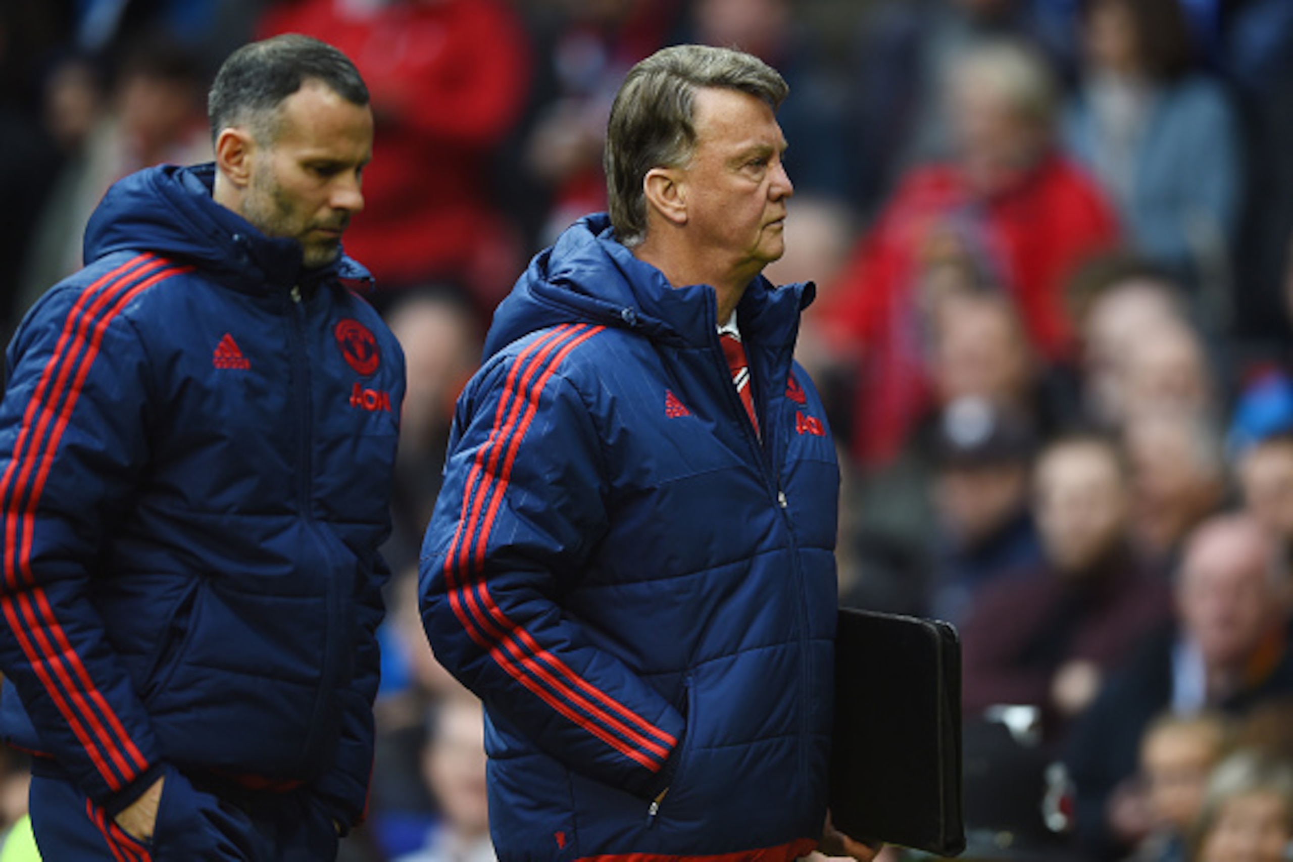MANCHESTER, UNITED KINGDOM - MAY 01:  Louis van Gaal, manager of Manchester United and assistant Ryan Giggs walk in for half time during the Barclays Premier League match between Manchester United and Leicester City at Old Trafford on May 1, 2016 in Manch