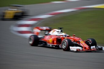 Ferrari's German driver Sebastian Vettel (R) takes a turn during the Formula One Chinese Grand Prix in Shanghai on April 17, 2016. / AFP / WANG ZHAO        (Photo credit should read WANG ZHAO/AFP/Getty Images)