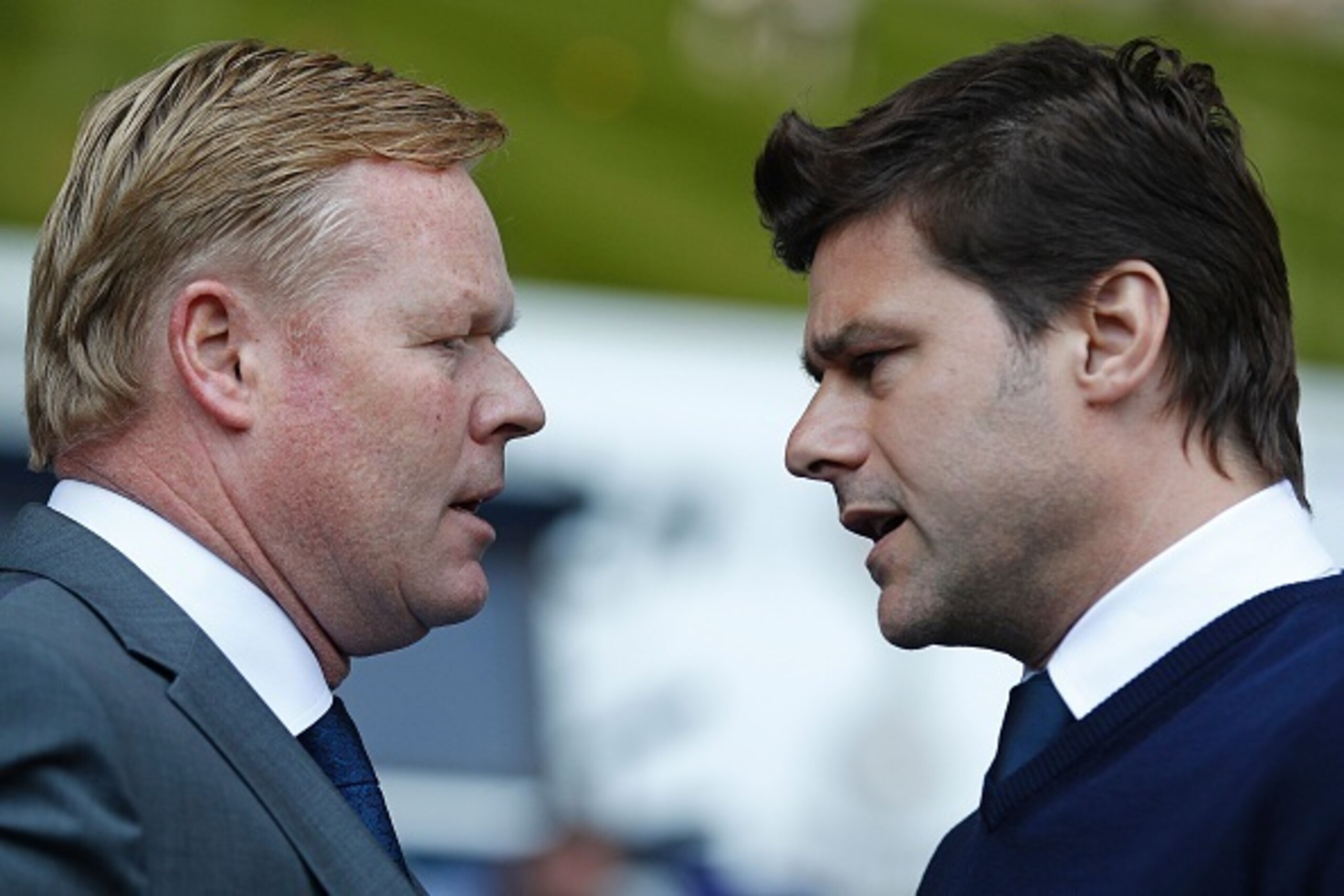 Southampton's Dutch manager Ronald Koeman (L) speaks with Tottenham Hotspur's Argentinian head coach Mauricio Pochettino before the English Premier League football match between Tottenham Hotspur and Southampton at White Hart Lane in London, on May 8, 201