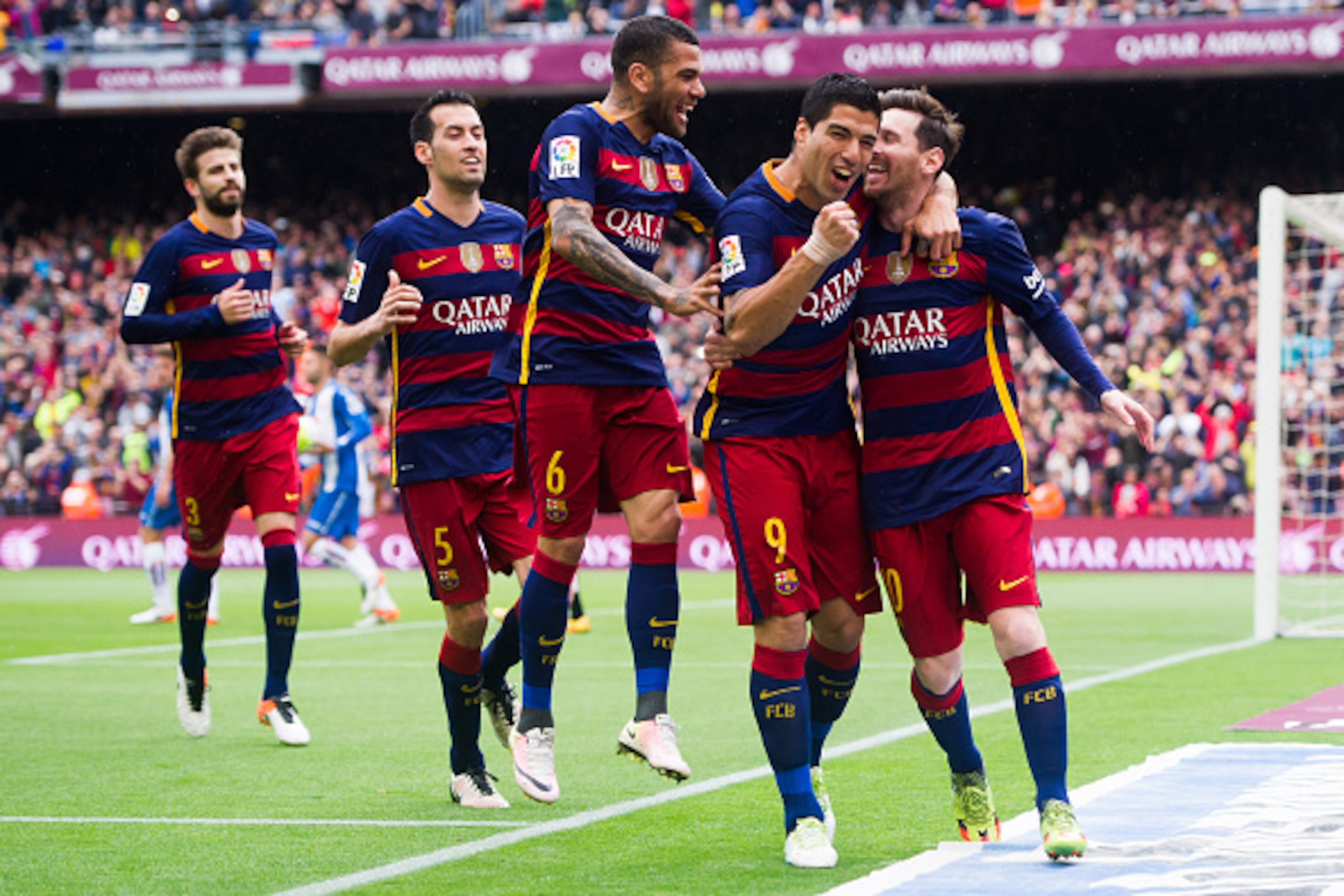 BARCELONA, SPAIN - MAY 08: (L-R) Gerard Pique, Sergio Busquets, Dani Alves and Luis Suarez celebrate with their teammate Lionel Messi after scoring the opening goal during the La Liga match between FC Barcelona and RCD Espanyol at Camp Nou on May 8, 2016 BARCELONA, SPAIN - MAY 08: (L-R) Gerard Pique, Sergio Busquets, Dani Alves and Luis Suarez celebrate with their teammate Lionel Messi after scoring the opening goal during the La Liga match between FC Barcelona and RCD Espanyol at Camp Nou on May 8, 2016