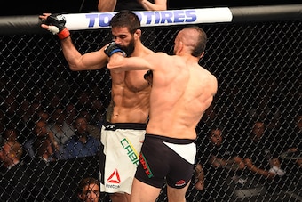 ROTTERDAM, NETHERLANDS - MAY 08:  (R-L) Reza Madadi punches Yan Cabral in their lightweight bout during the UFC Fight Night event at Ahoy Rotterdam on May 8, 2016 in Rotterdam, Netherlands. (Photo by Josh Hedges/Zuffa LLC/Zuffa LLC via Getty Images)