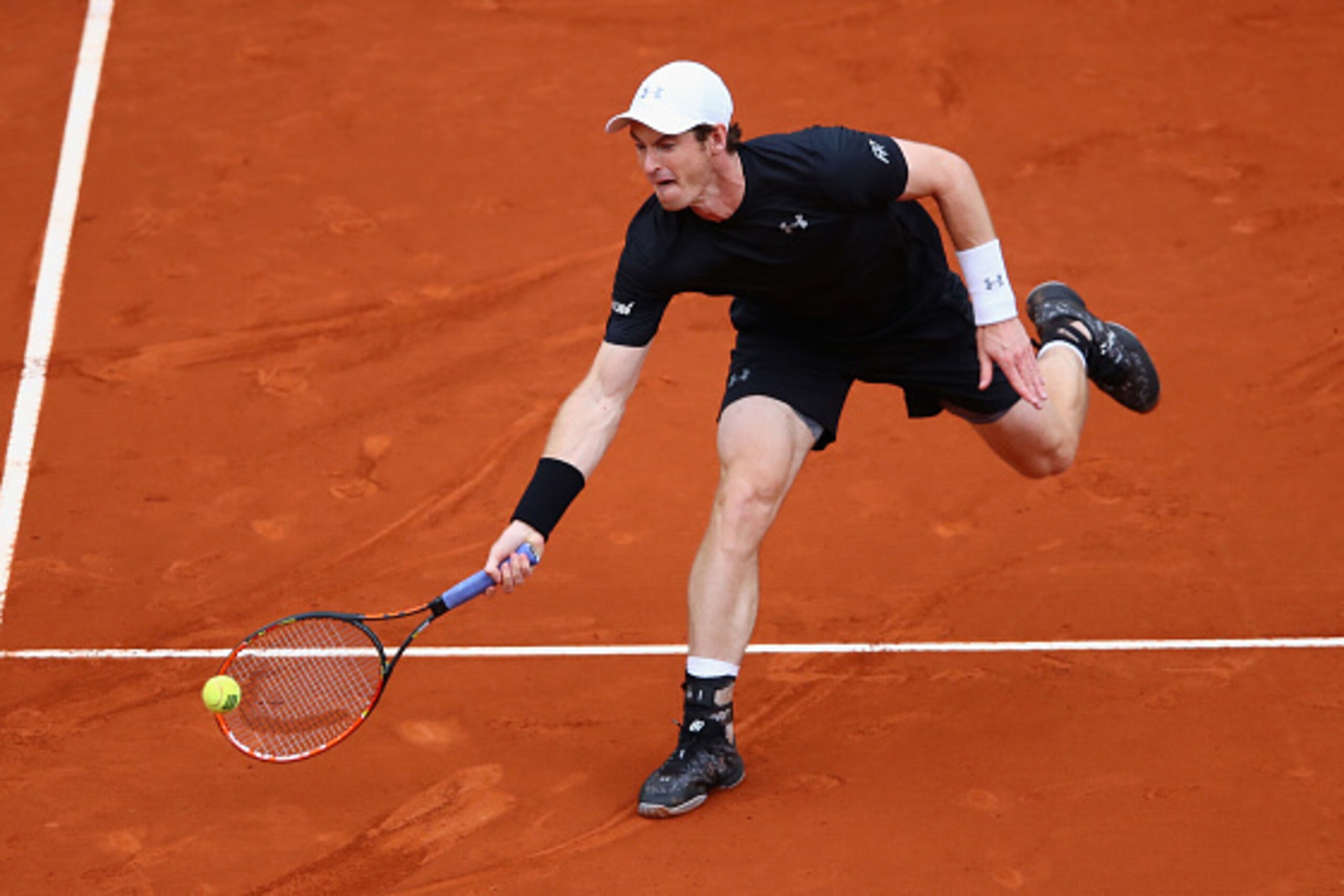 MADRID, SPAIN - MAY 08:  Andy Murray of Great Britain volleys against Novak Djokovic of Serbia in the mens final during day nine of the Mutua Madrid Open tennis tournament at the Caja Magica on May 08, 2016 in Madrid,Spain.  (Photo by Clive Brunskill/Gett