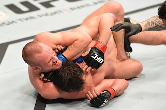 ROTTERDAM, NETHERLANDS - MAY 08:  (L-R) Gunnar Nelson submits Albert Tumenov in their welterweight bout during the UFC Fight Night event at Ahoy Rotterdam on May 8, 2016 in Rotterdam, Netherlands. (Photo by Josh Hedges/Zuffa LLC/Zuffa LLC via Getty Images