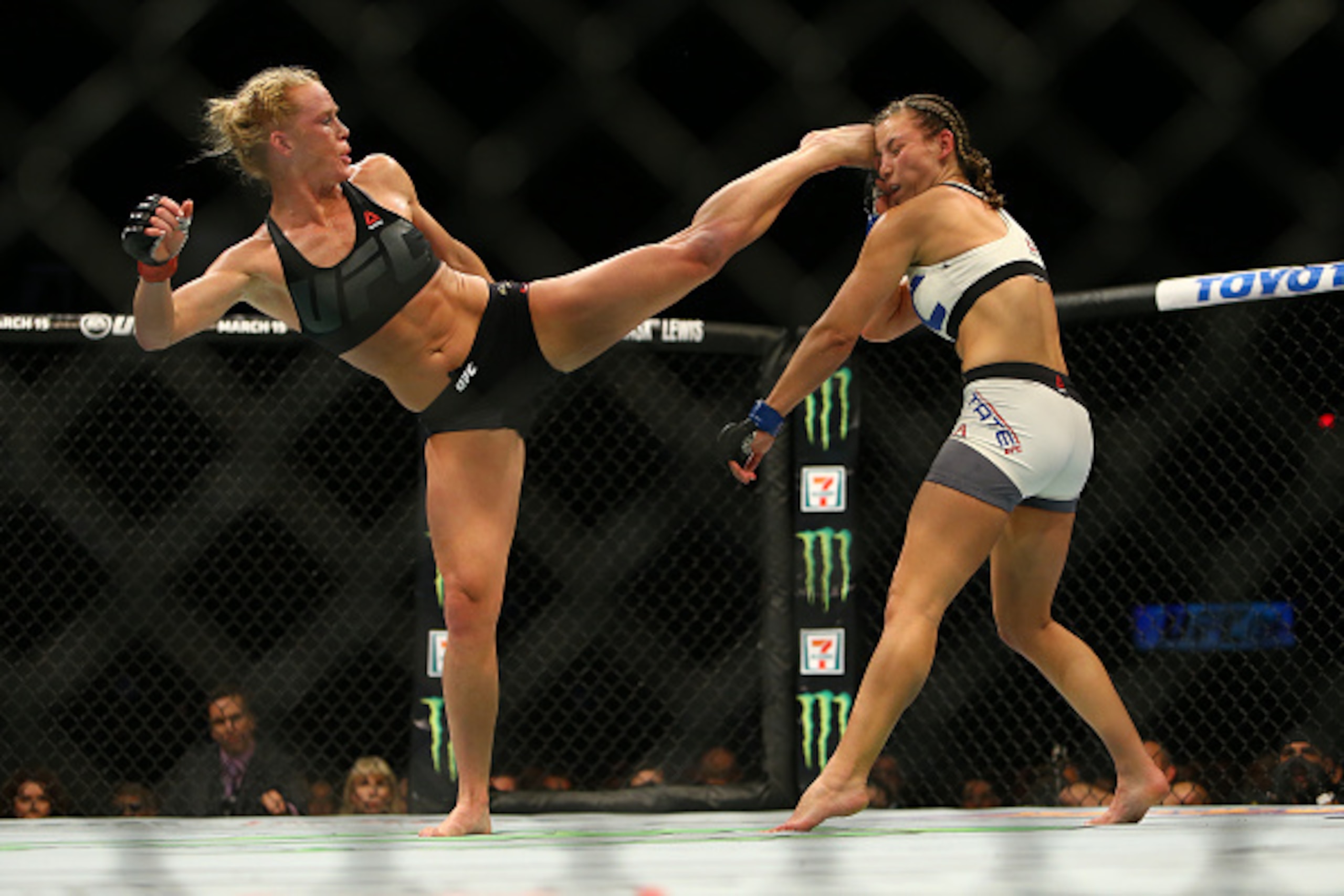 LAS VEGAS, NV - MARCH 5:  UFC bantamweight champion Holly Holm (L) kicks Miesha Tate takes during UFC 196 at the MGM Grand Garden Arena on March 5, 2016 in Las Vegas, Nevada. (Photo by Rey Del Rio/Getty Images)