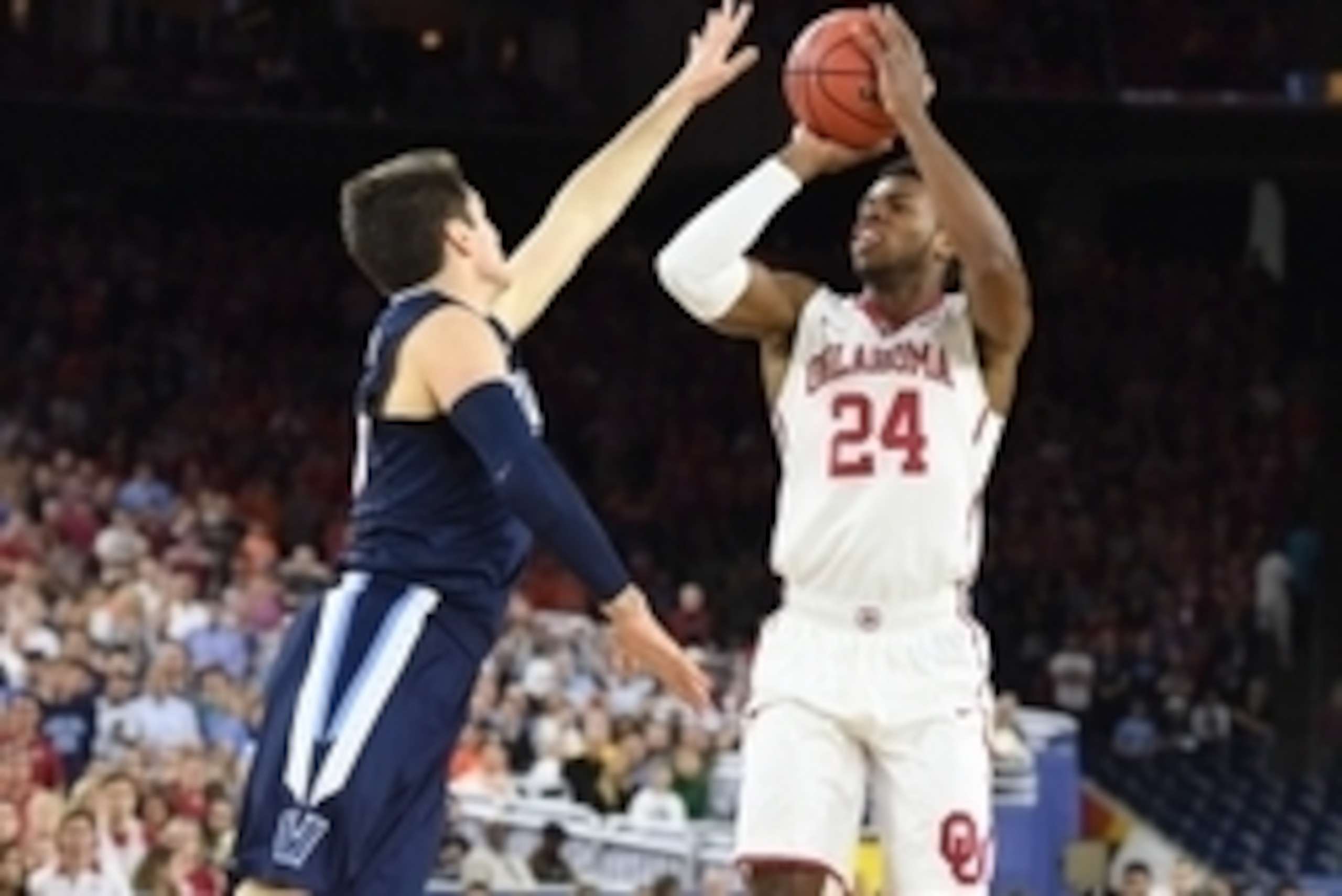 Apr 2, 2016; Houston, TX, USA; Oklahoma Sooners guard Buddy Hield (24) shoots over Villanova Wildcats guard Ryan Arcidiacono (15) in the first half  in the 2016 NCAA Men's Division I Championship semi-final game at NRG Stadium. Mandatory Credit: Robert De