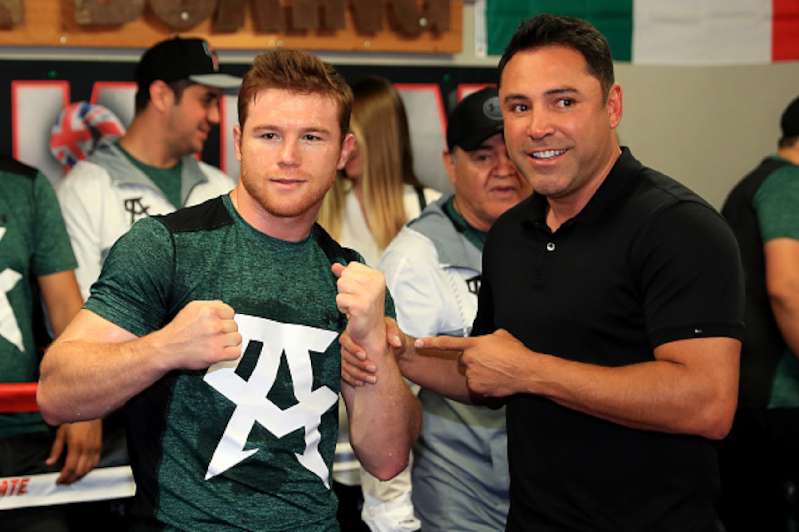 SAN DIEGO, CA - APRIL 25:  WBC middleweight champion Canelo Alvarez poses with Chairman and CEO of Golden Boy Productions Oscar De La Hoya during a media workout at the House of Boxing Gym on April 25, 2016 in San Diego, California.  (Photo by Sean M. Haf