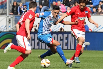 Hoffenheim's midfielder Nadiem Amiri (C), Hertha's midfielder Niklas Stark (L) and Hertha's Japanese midfielder Genki Haraguchi (R) vie for the ball during the German first division Bundesliga football match Hoffenheim vs Hertha Berlin in Sinsheim, southe