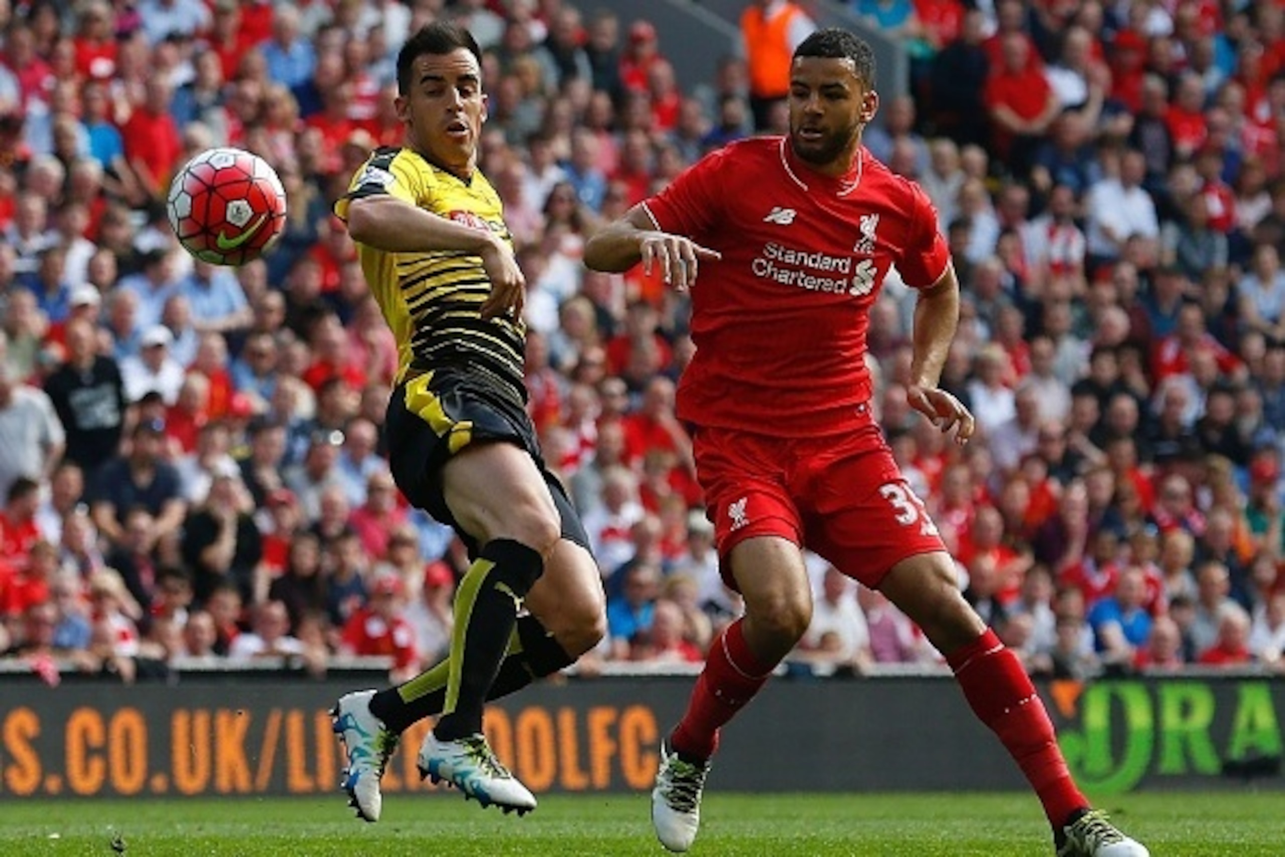Watford's Spanish midfielder Jose Manuel Jurado (l) vies with Liverpool's English defender Kevin Stewart during the English Premier League football match between Liverpool and Watford at Anfield in Liverpool, north west England on May 8, 2016. / AFP / LIN