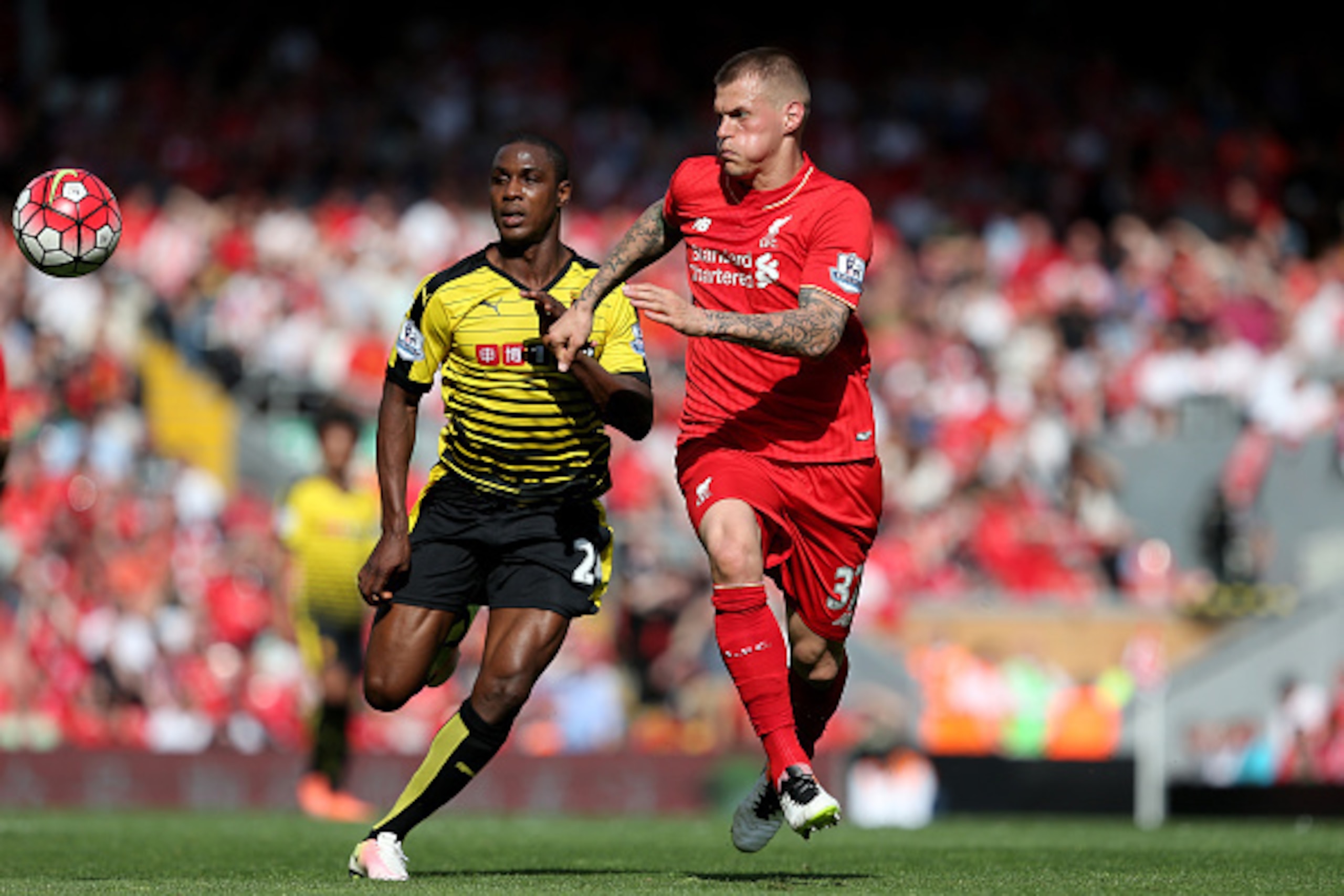 LIVERPOOL, ENGLAND - MAY 08:  Martin Skrtel of Liverpool holds off Odion Ighalo of Watford during the Barclays Premier League match between Liverpool and Watford at Anfield on May 8, 2016 in Liverpool, England.  (Photo by Jan Kruger/Getty Images)