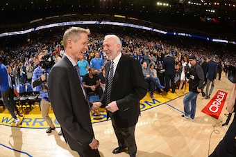 OAKLAND, CA  - APRIL 7: Head coach, Steve Kerr of the Golden State Warriors and head coach, Gregg Popovich of the San Antonio Spurs before the game on April 7, 2016 at ORACLE Arena in Oakland, California. NOTE TO USER: User expressly acknowledges and agre