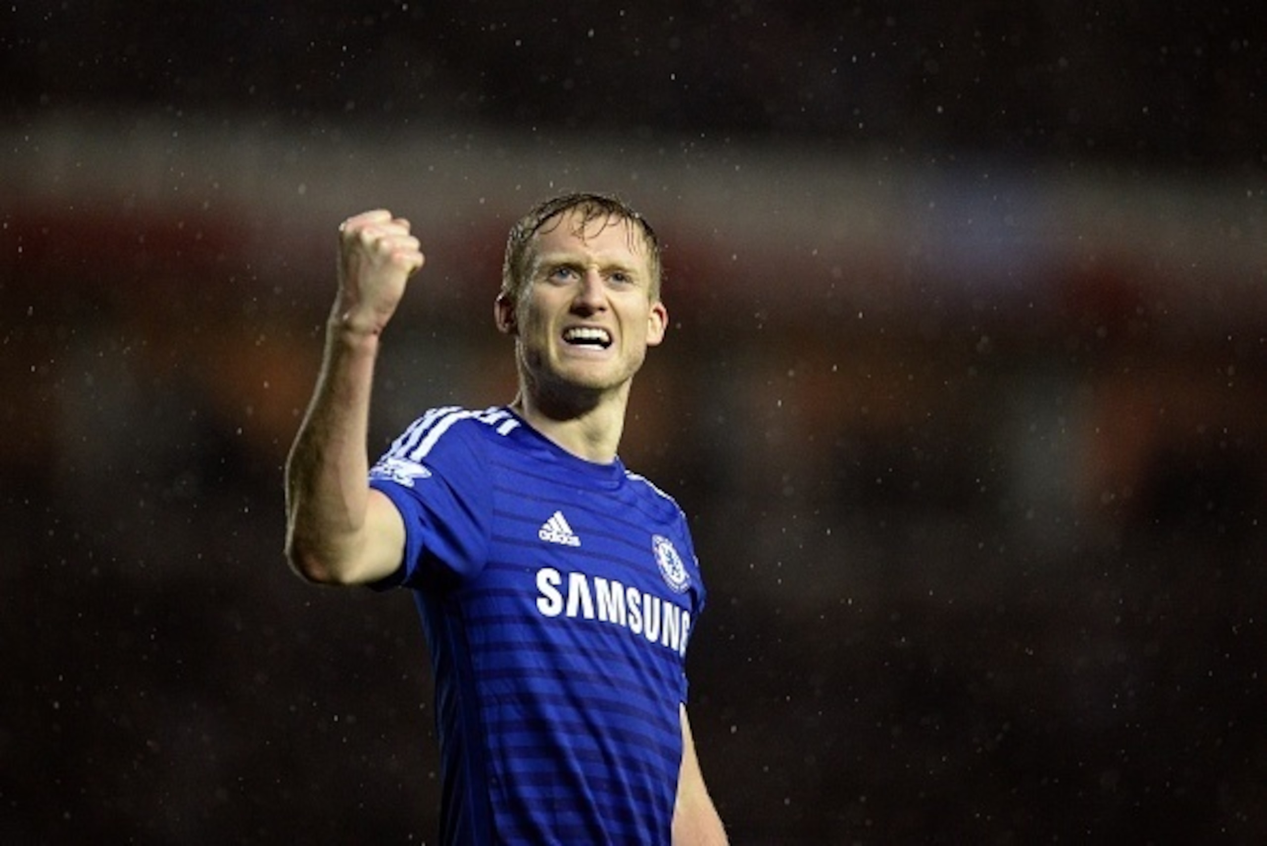 Chelsea's German striker Andre Schurrle celebrates after scoring their third goal during the English League Cup quarter-final football match between Derby County and Chelsea at iPro Stadium in Derby, central England on December 16, 2014. Chelsea won the g