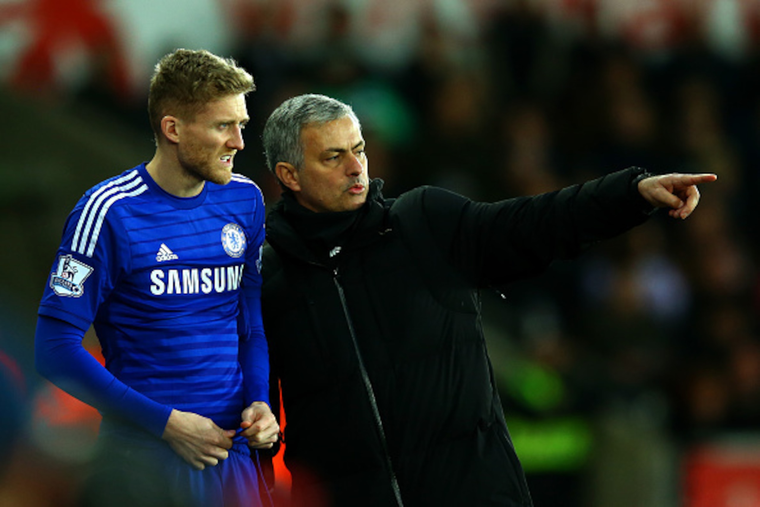 SWANSEA, WALES - JANUARY 17:  Jose Mourinho, manager of Chelsea speaks with Andre Schuerrle of Chelsea as he prepares to gon on during the Barclays Premier League match between Swansea City and Chelsea at Liberty Stadium on January 17, 2015 in Swansea, Wa