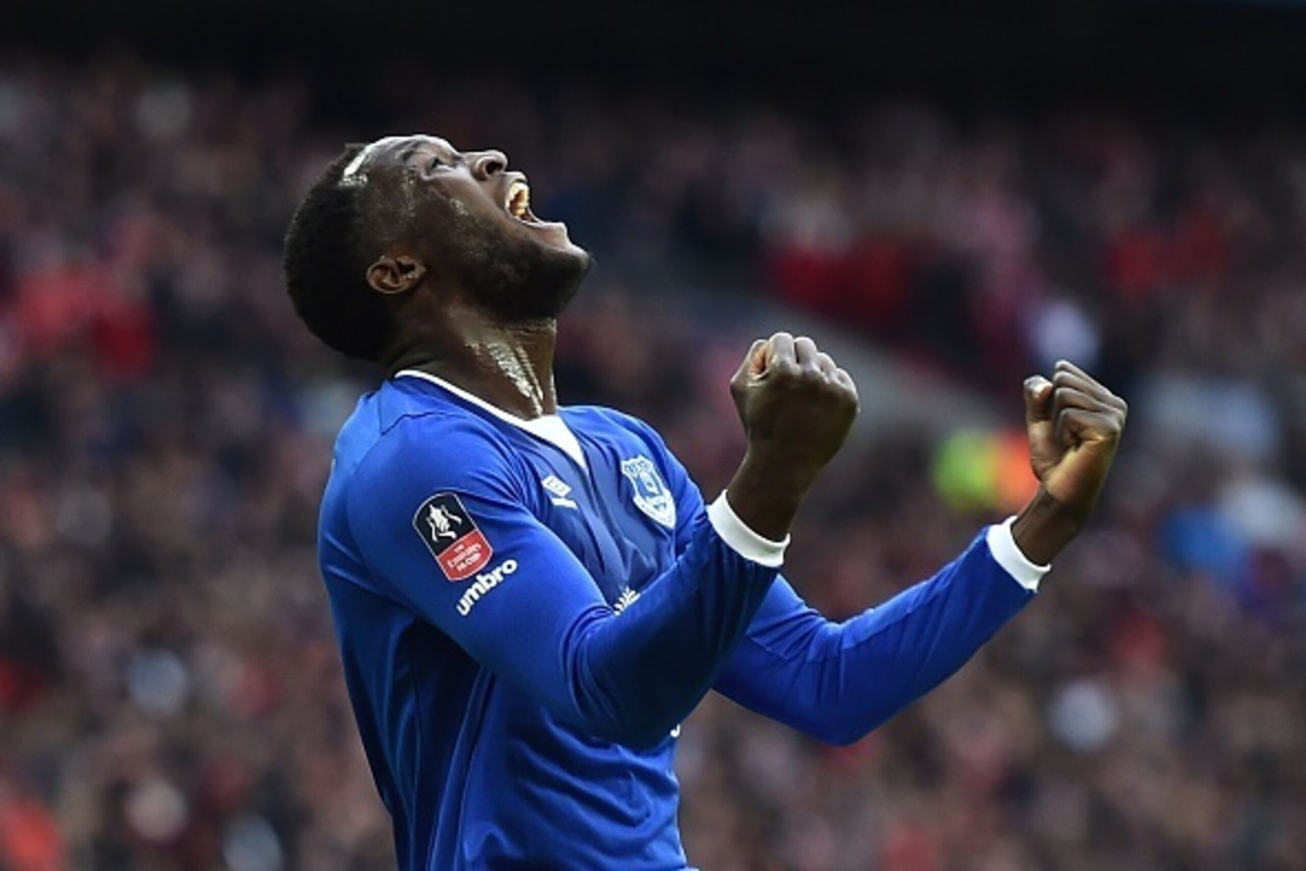 Everton's Belgian striker Romelu Lukaku celebrates after Manchester United's English defender Chris Smalling turned in a cross from Everton's Spanish midfielder Gerard Deulofeu to score an own goal to equalise the scores 1-1 during the English FA Cup semi