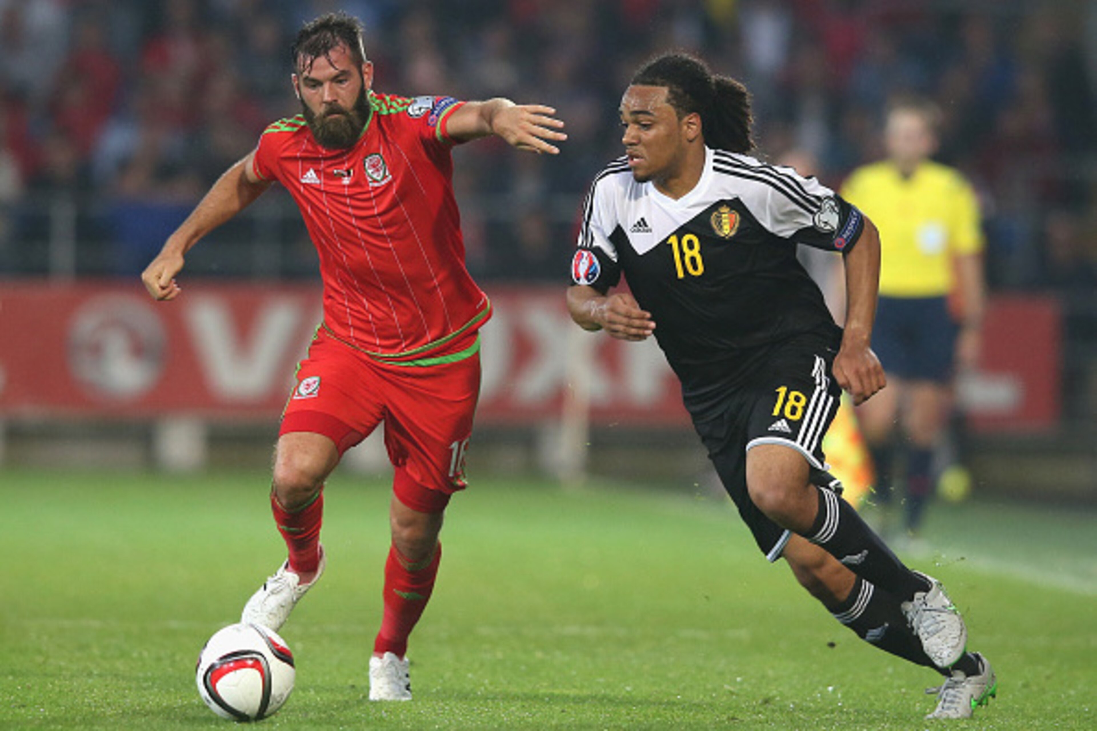 CARDIFF, WALES - JUNE 12:  Joe Ledley (L) of Wales moves away from Jason Denayer during the UEFA EURO 2016 qualifying match between Wales and Belgium at the Cardiff City Stadium on June 12, 2015 in Cardiff, United Kingdom.  (Photo by David Rogers/Getty Im