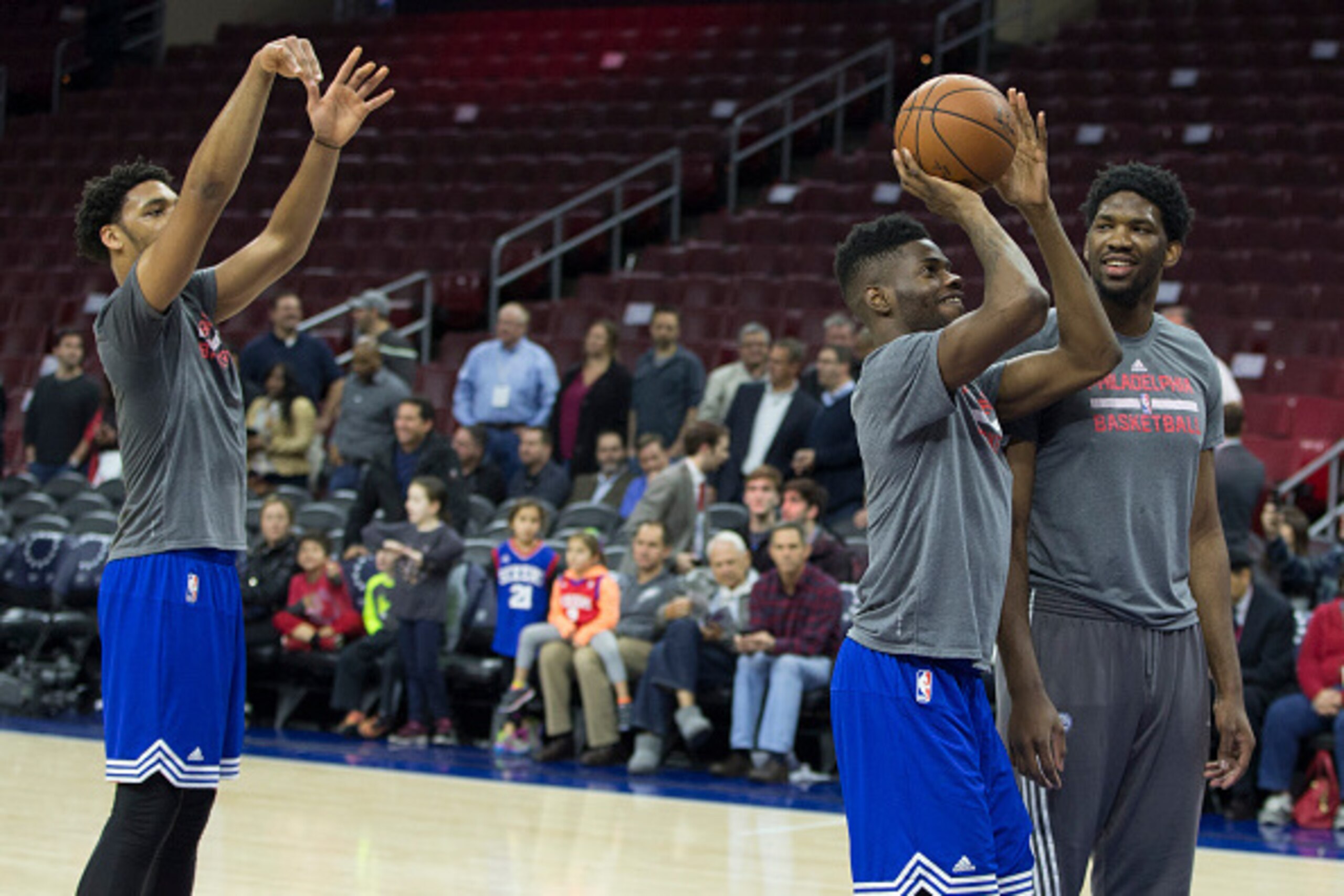 PHILADELPHIA, PA - DECEMBER 22: Jahlil Okafor #8, Nerlens Noel #4, and Joel Embiid #21 of the Philadelphia 76ers warm up prior to the game against the Memphis Grizzlies on December 22, 2015 at the Wells Fargo Center in Philadelphia, Pennsylvania. NOTE TO 
