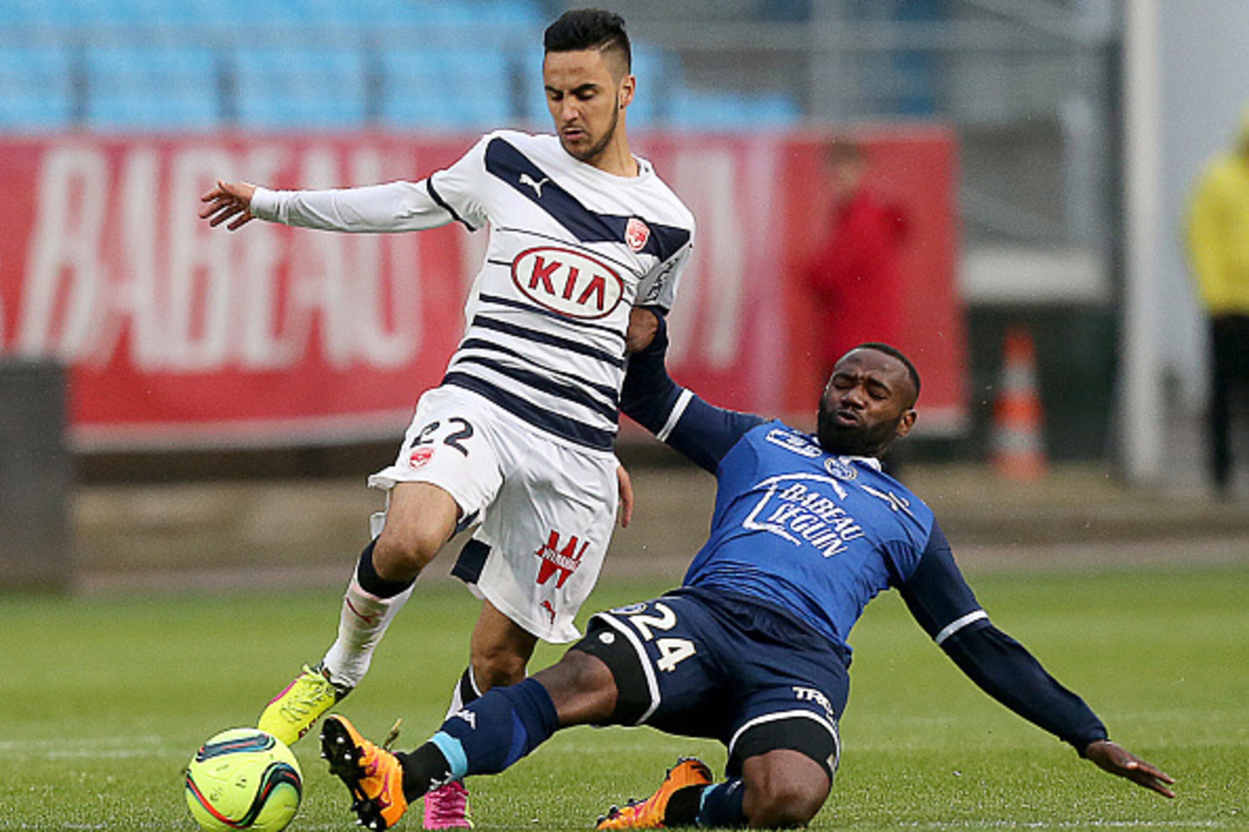 Troyes' French midfielder Lossemy Karaboue (R) vies for the ball with Bordeaux' French forward Adam Ounas (L) during the French L1 football match between Troyes (ESTAC) and Bordeaux (FCGB) on April 30, 2016 at the Aube Stadium in Troyes, eastern France. A