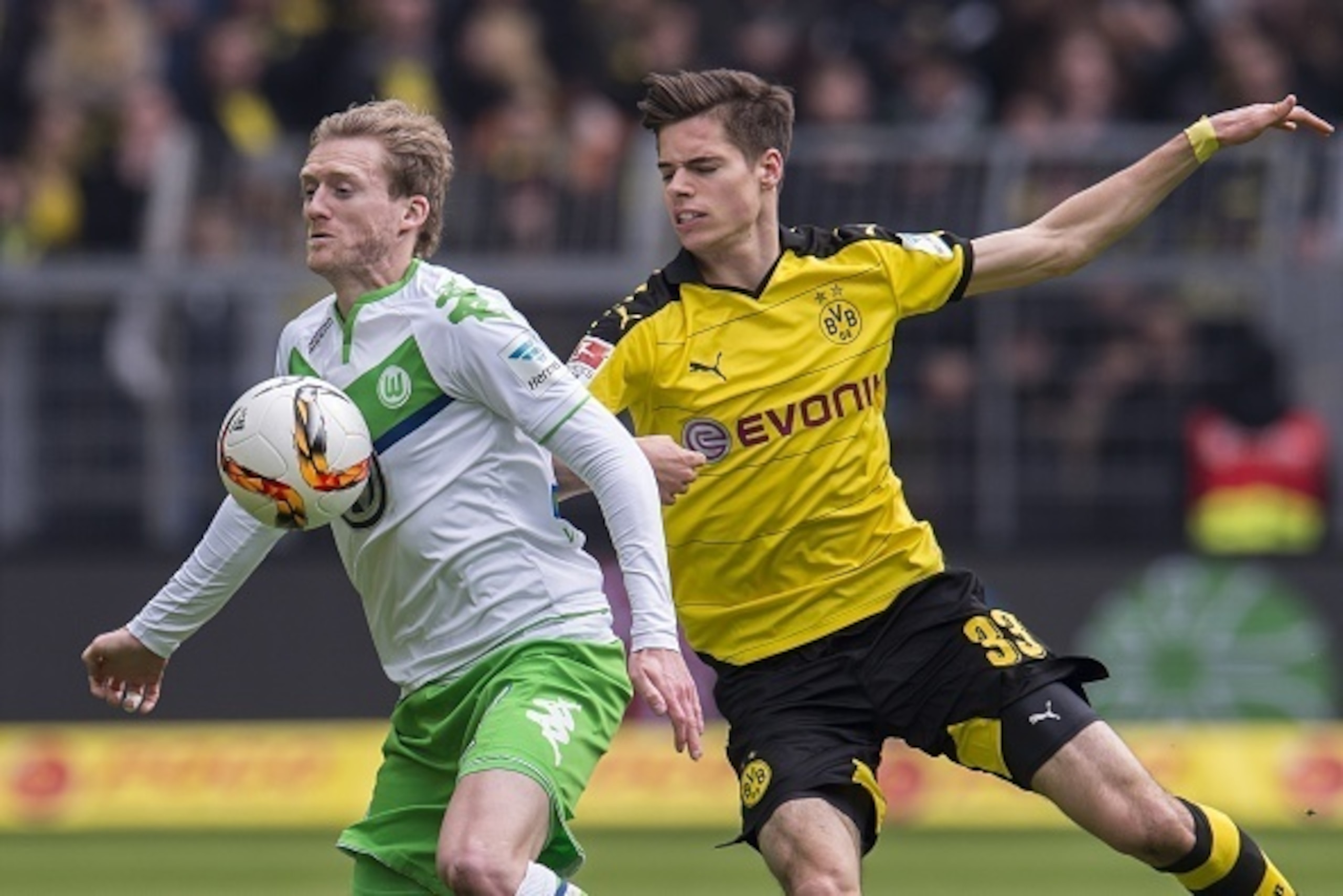 (L-R) Andrï¿½ï¿½ Schï¿½ï¿½rrle of VFL Wolfsburg, Julian Weigl of Borussia Dortmund during the Bundesliga match between Borussia Dortmund and VfL Wolfsburg on April 30, 2016 at the Signal Idun Park stadium in Dortmund, Germany.(Photo by VI Images via Getty Images)